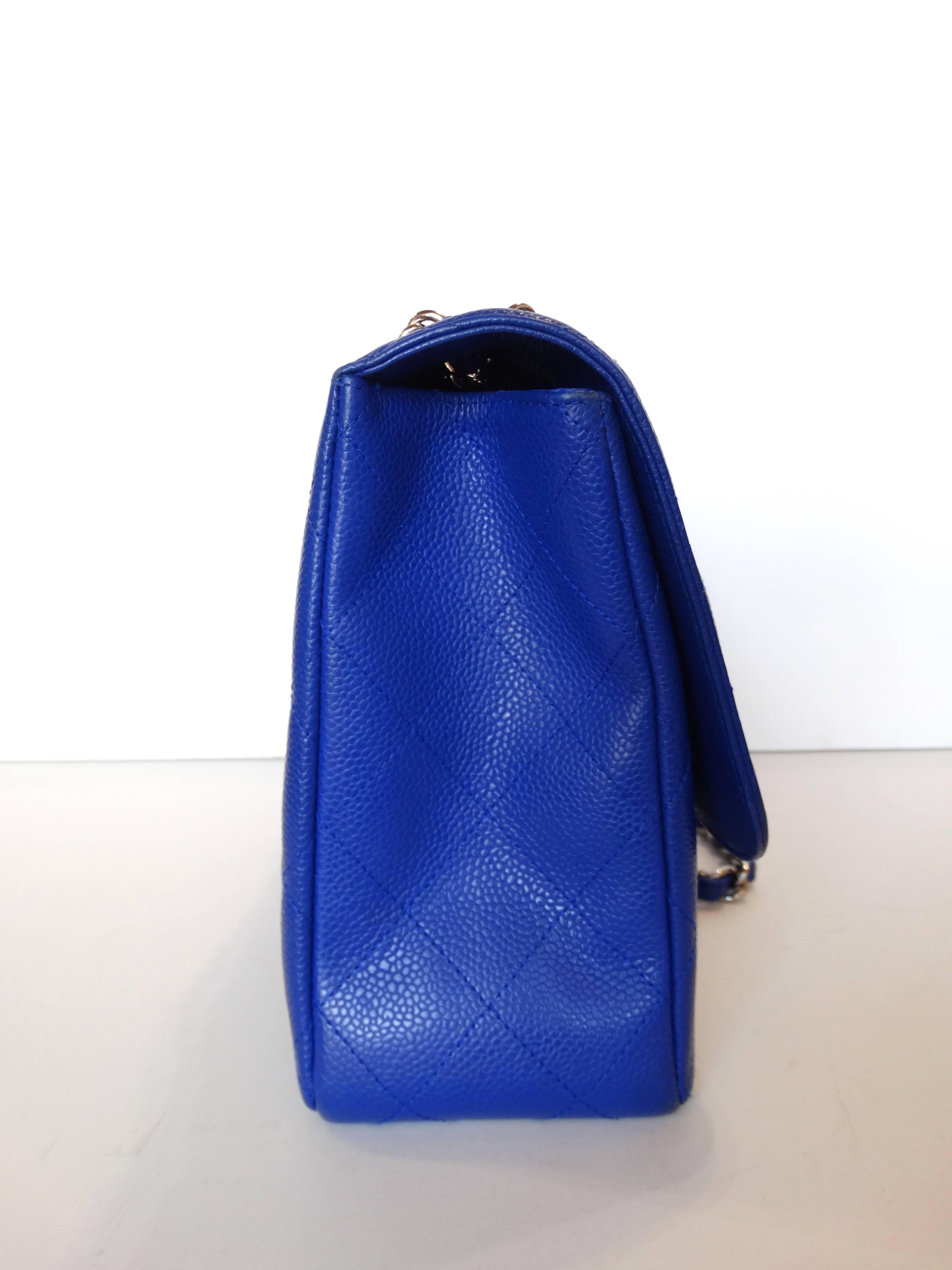 This bag is classic meets modern: with it's signature Chanel 10C Caviar Jumbo Classic in an oh-so-contemporary bleu roi color! The Jumbo size makes it the perfect everyday bag for carrying all your essentials. Textured caviar leather with stitched