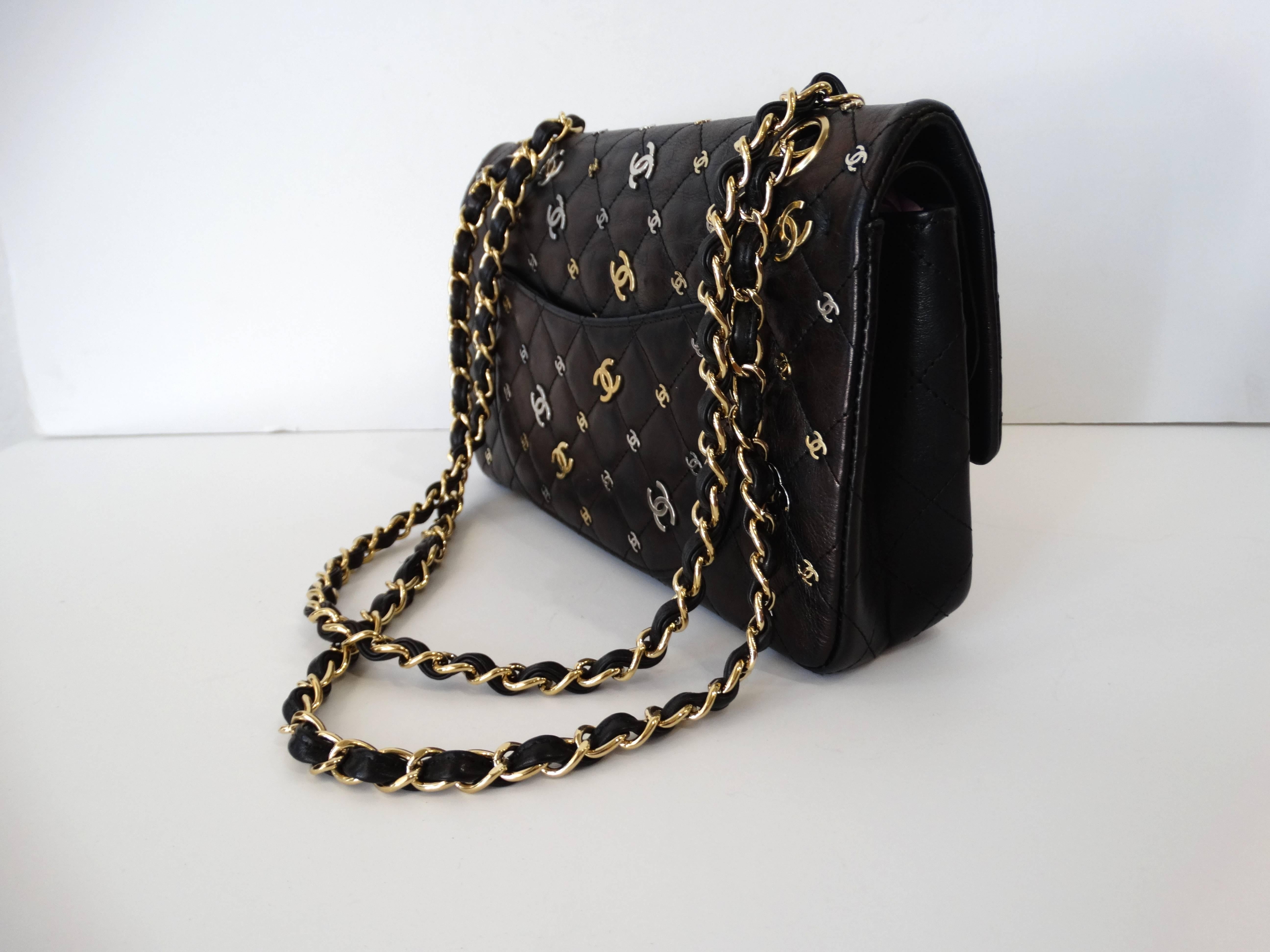 From the Spring 2007 Collection. Black quilted Chanel CC Punk 2.55 Reissue 225 Flap bag with brushed gold-tone, silver-tone and gunmetal hardware, chain-link and leather shoulder straps, logo CC's at quilted cross-sections. single pocket at back,