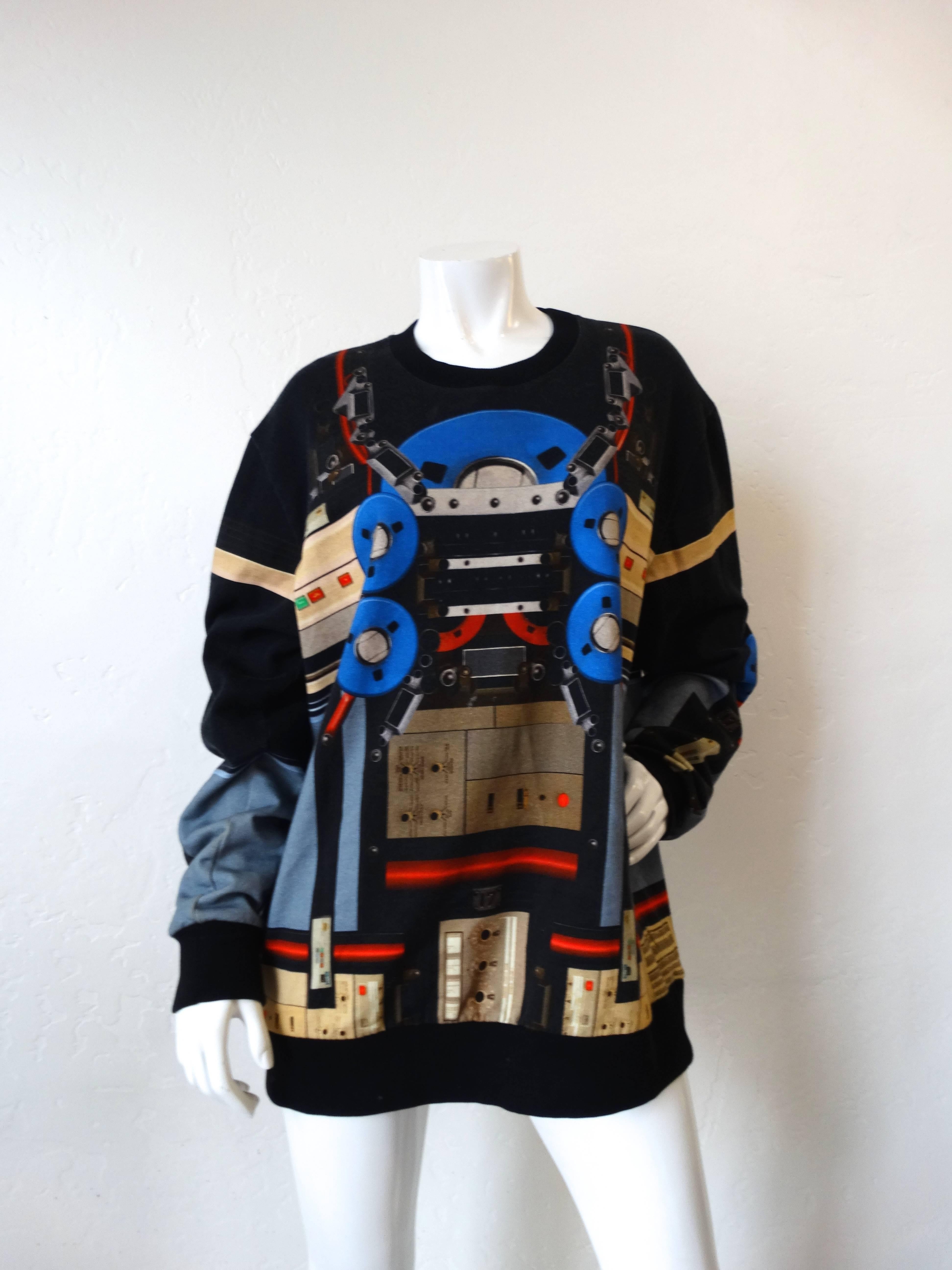Cozy with a futuristic twist! Up your loungewear game with our Givenchy robot sweatshirt! Soft cotton with crew-neck and long sleeve print. Super unique robot print all over. Marked a size Men's small, unisex fit. 

Shoulder: 21 in 
Sleeve: 26 in