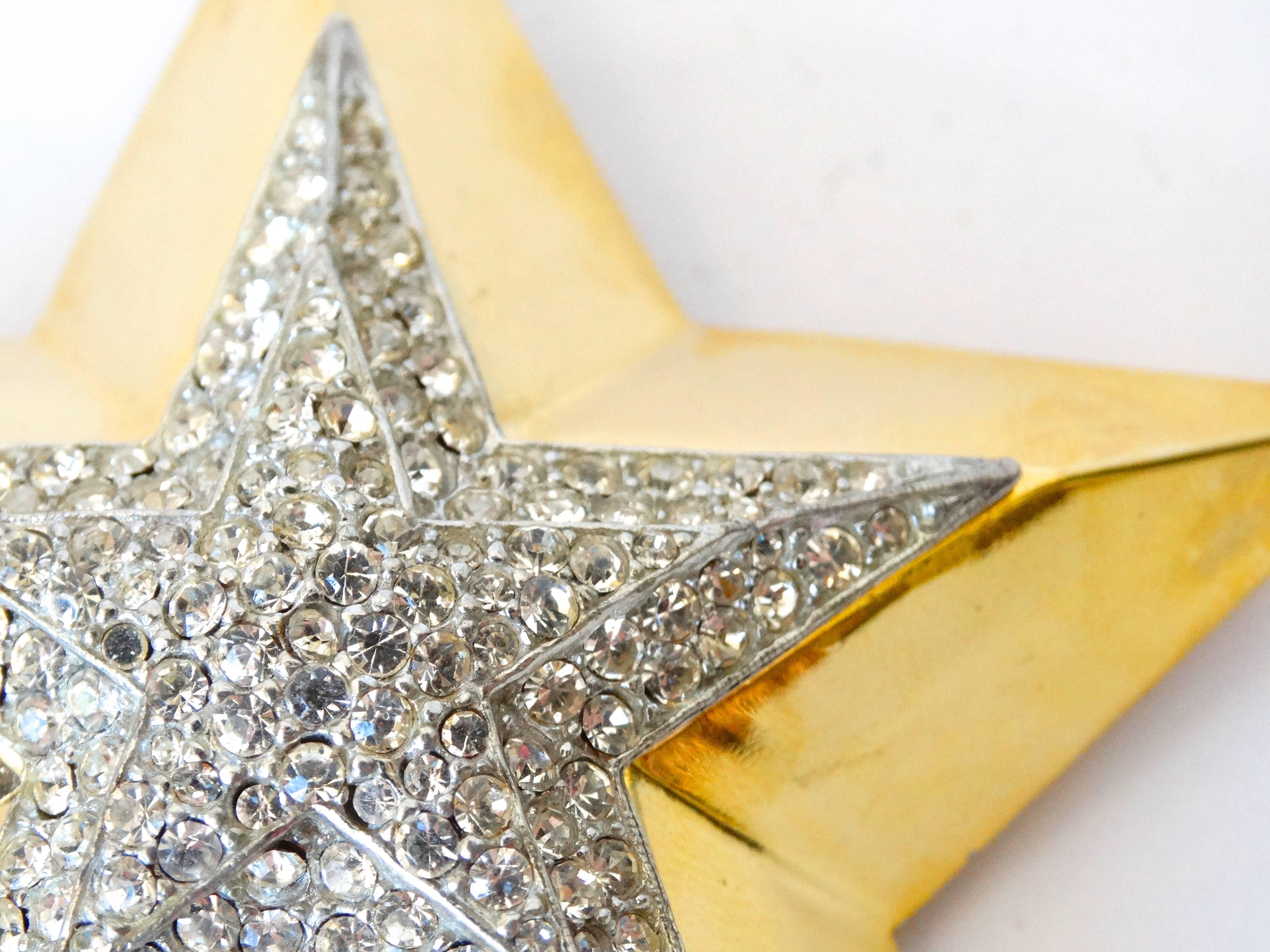 You get a gold star! (Brooch, that is.) Jazz up your jacket's and ascots with our adorable 1980s star brooch! Cast in a bright gold metal with silver star at the center, encrusted with many little crystal rhinestones. Pins at the back, unsigned.