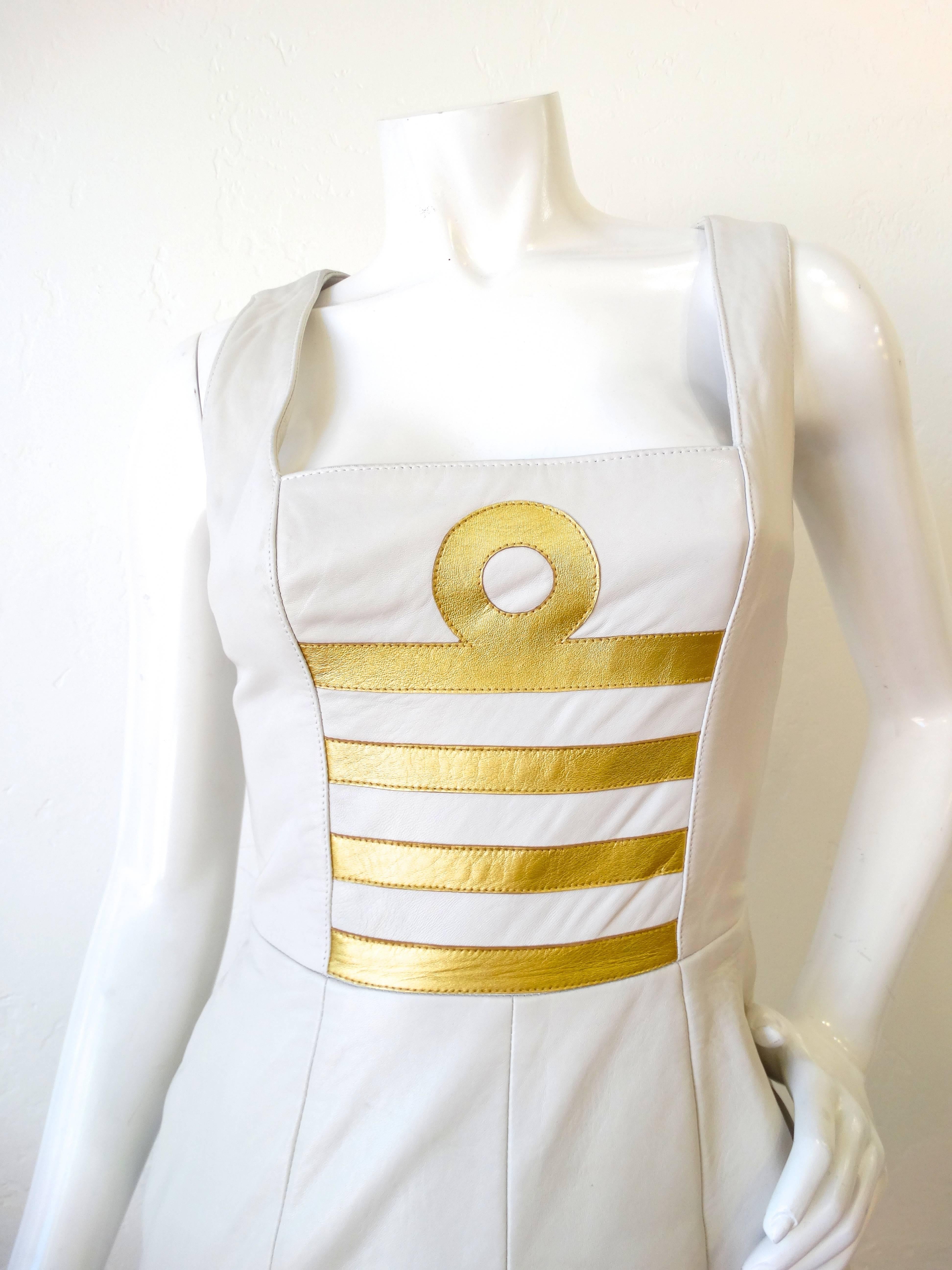 Incredible 1980s body-con dress from iconic leather designer Michael Hoban! Made of a super soft winter white colored leather with gold leather accented stitched into the bodice. Detailed stitching allows for a sexy tailored body con fit. Libra