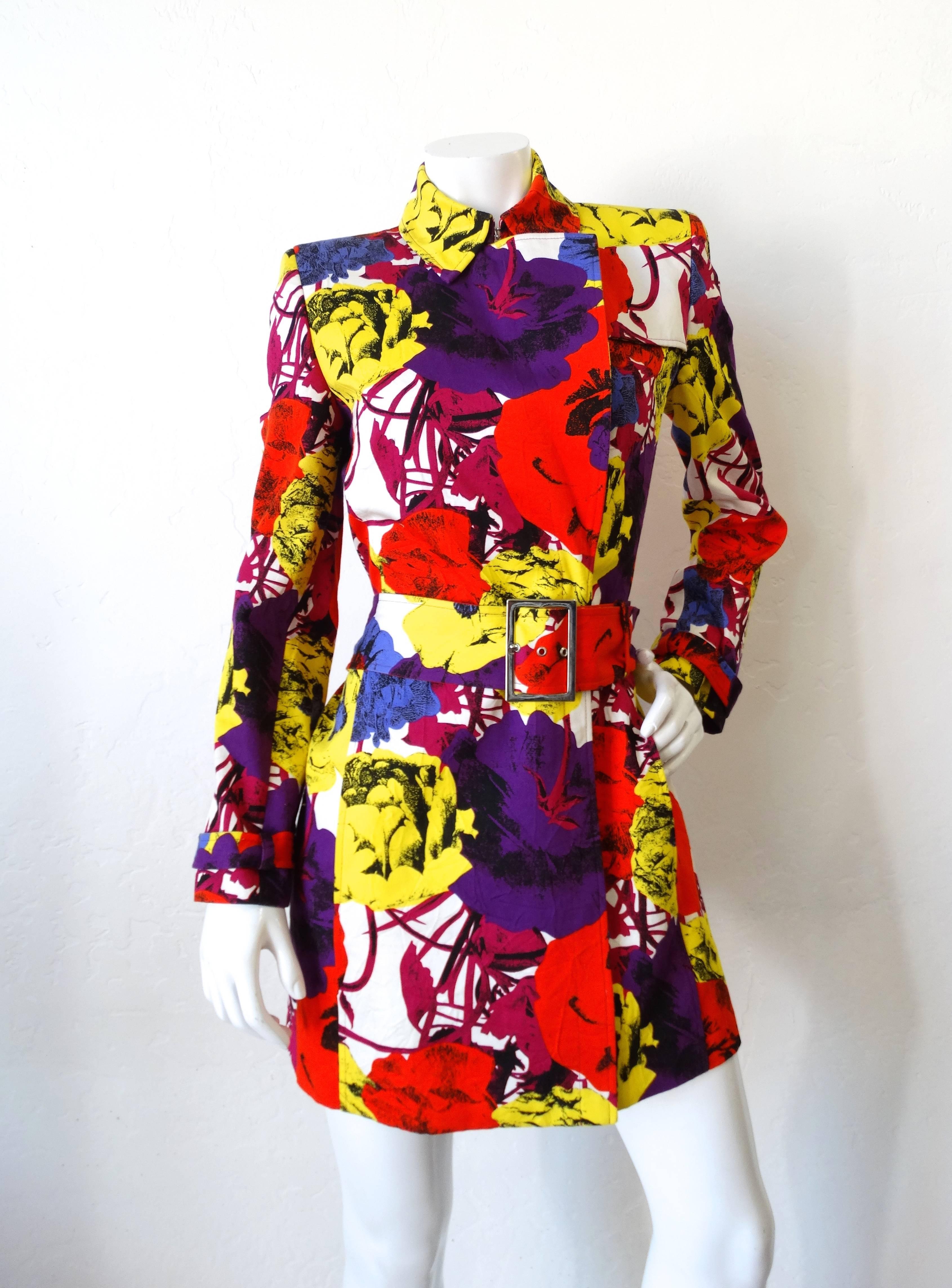 Incredible 1990s Gianni Versace Pop Art floral trench coat! Mini trench coat fit with belted waist and cuffs. Collar can be worn folder over, or closed for a more mod look (pictured both ways.) Super bold pop art print with floral motifs throughout