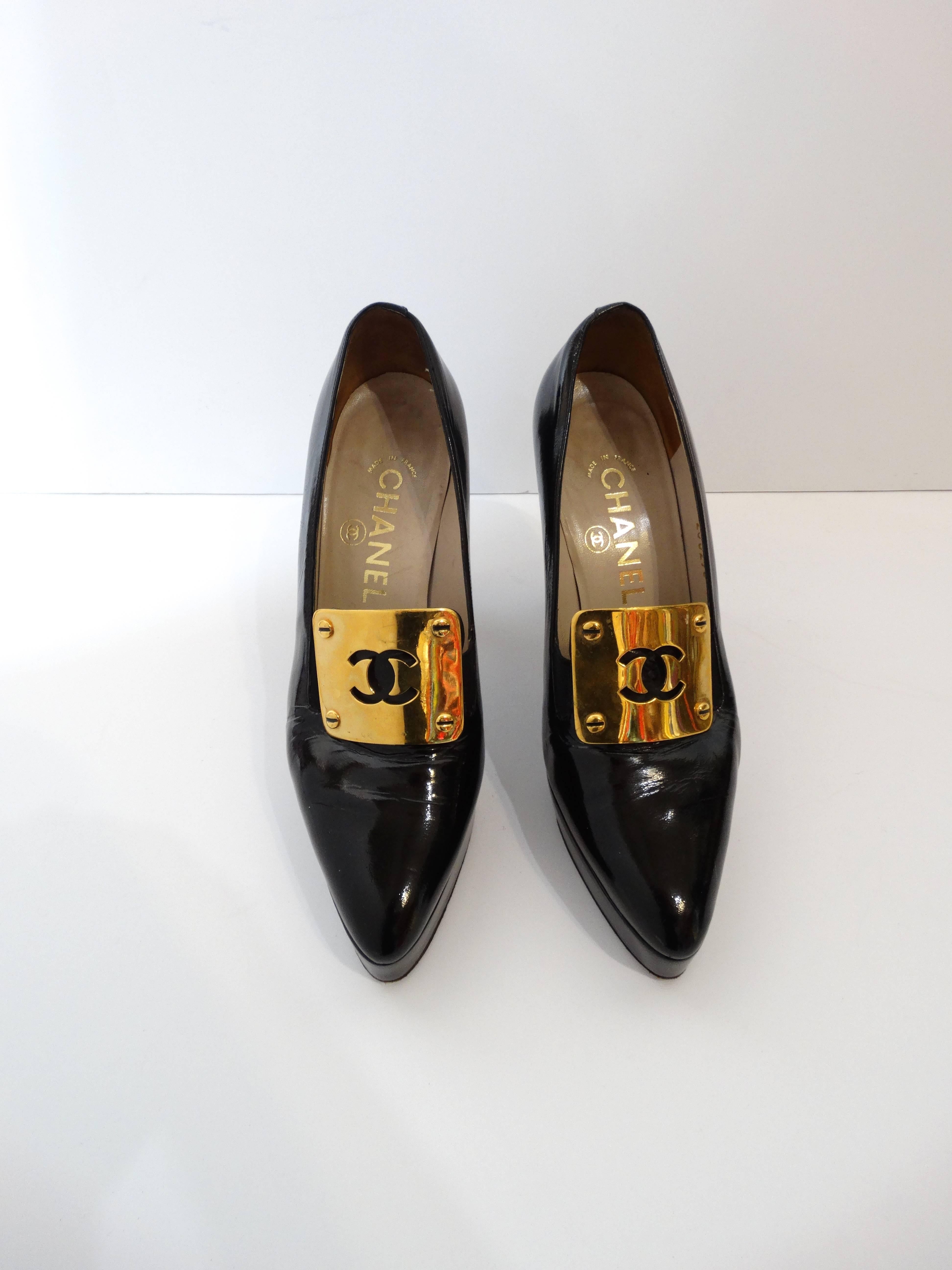 Make a statement in our super rare 1990s Chanel platform pumps! Made of a super glossy black patent leather with shiny gold metal CC plaques. Platform style makes these super comfortable for wear all night long! Stylish and punky pointed toe. Marked