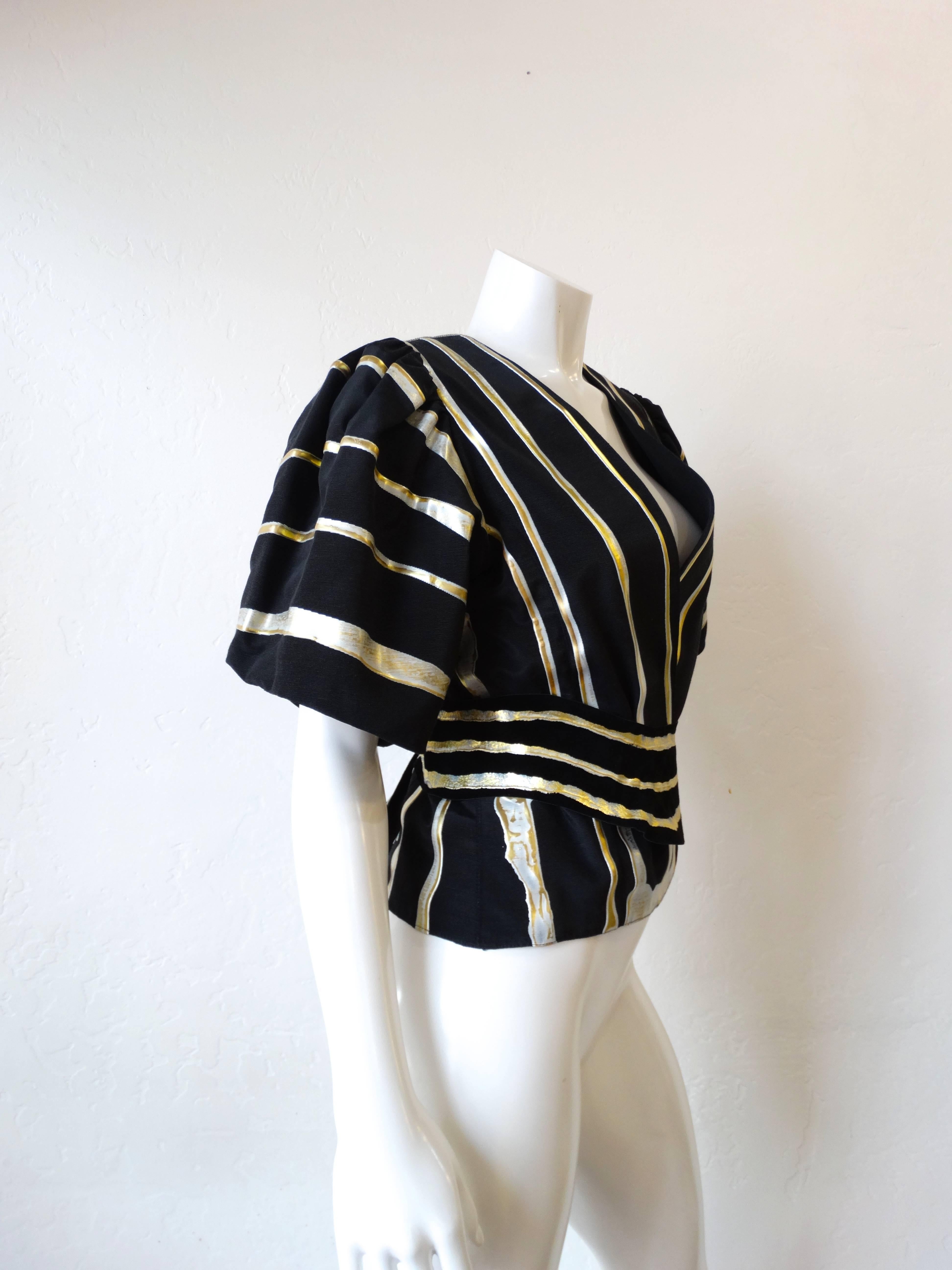 Amazing 1980s I. Magnin hand painted blouse! Super flattering fit with short blouson sleeves. Constructed with a black grosgrain texture fabric with silver and gold hand painted stripes throughout. Matching suede leather belt ties in the back or