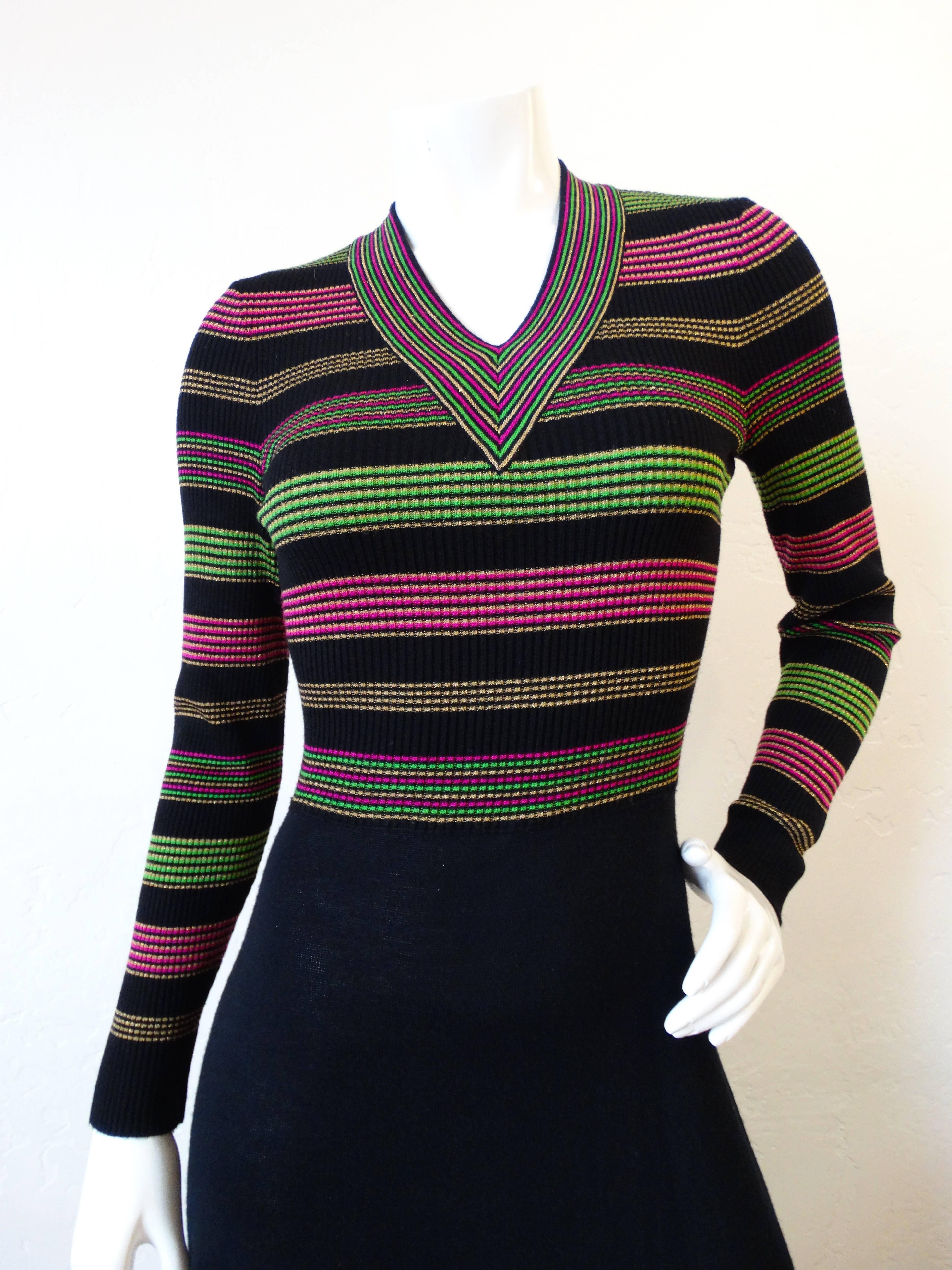 Channel the spirit of the 1970s with our adorable Saks Fifth Avenue lurex dress! Oh so 70s striped bodice woven from a metallic lurex knit in shades of gold, green and pink. Similar stripes on the hem of the skirt. Zips up the back, stretchy fabric