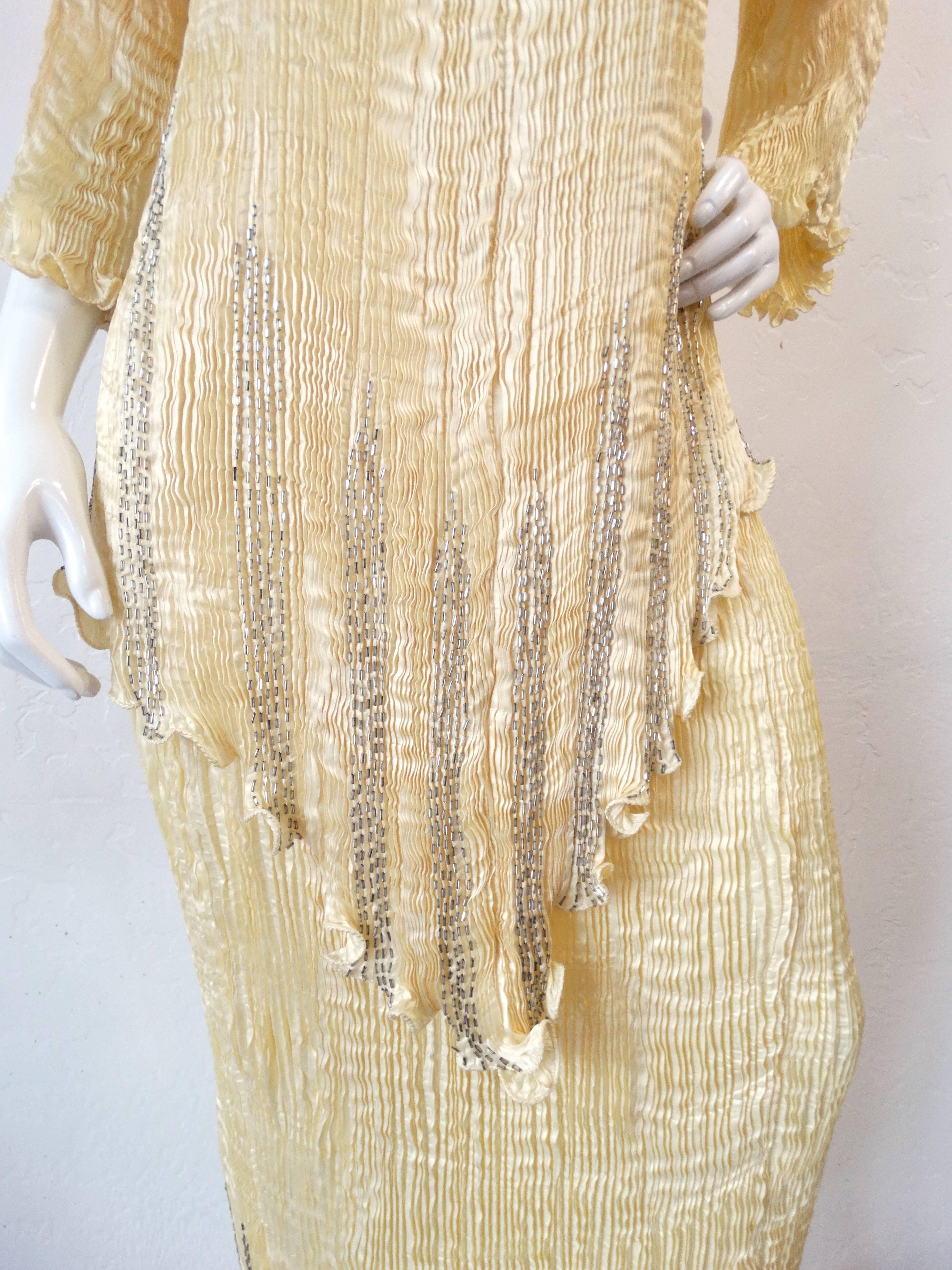 This set is a thing of beauty! From 1980s brand Capriccio in collaboration with Patricia Lester! Silky fortuny micro-pleated fabric in a lemony yellow color! Long top with a hanky-esque hem. Maxi length skirt with elasticized waist for an adjustable