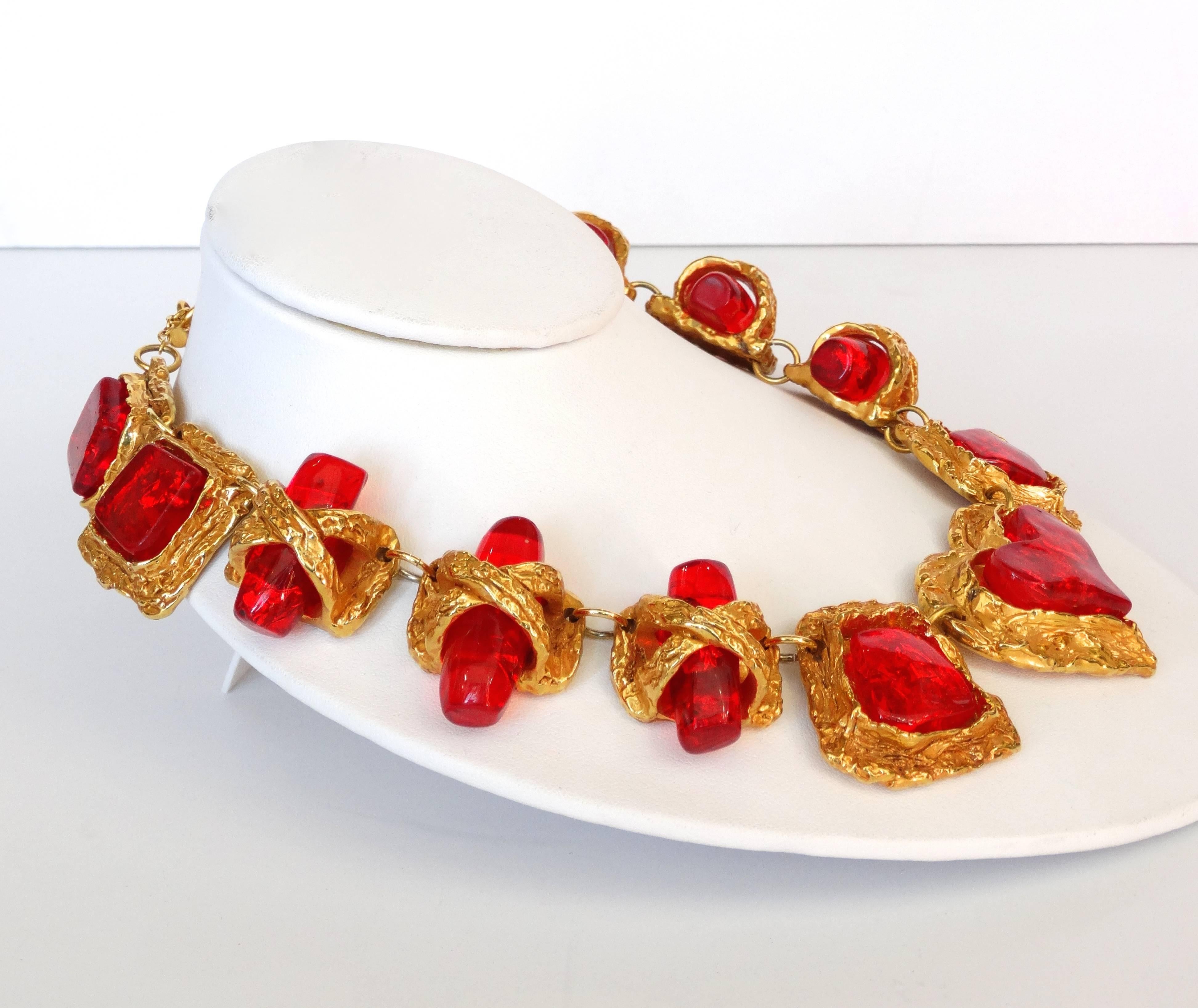 We LIVE for Christian La Croix's vintage jewelry- this piece is no exception! Incredible 1980s statement necklace with heart shaped pendant at the center. Brushed, crumpled textured gold metal with translucent red enamel jewels. Foil suspended in