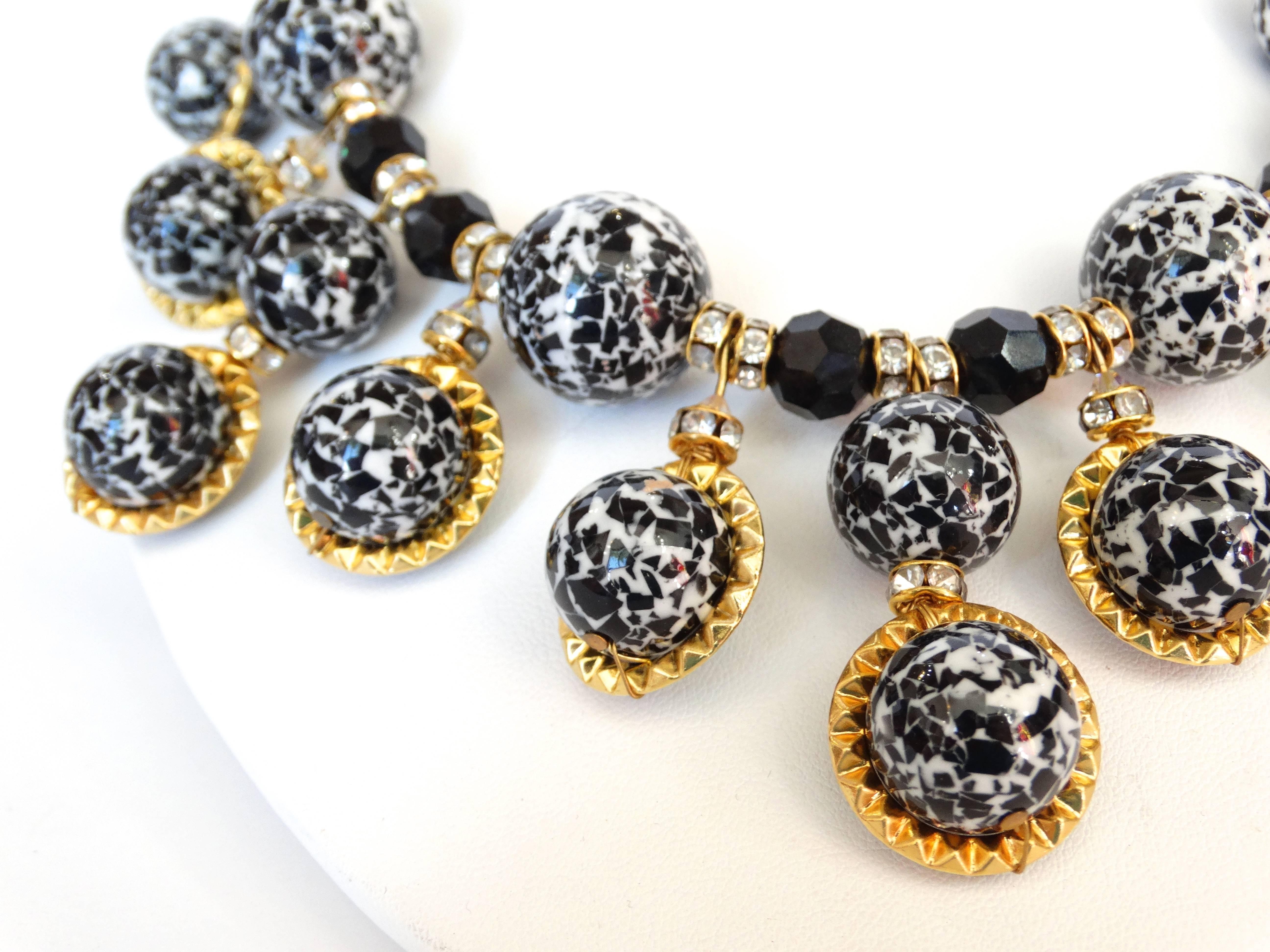 Incredible 1980s confetti bead necklace with matching earrings! The perfect baubles to give that little black dress some character! Black and white marbled beads accented with crimped gold metal and rhinestones. Button earrings in the same black and