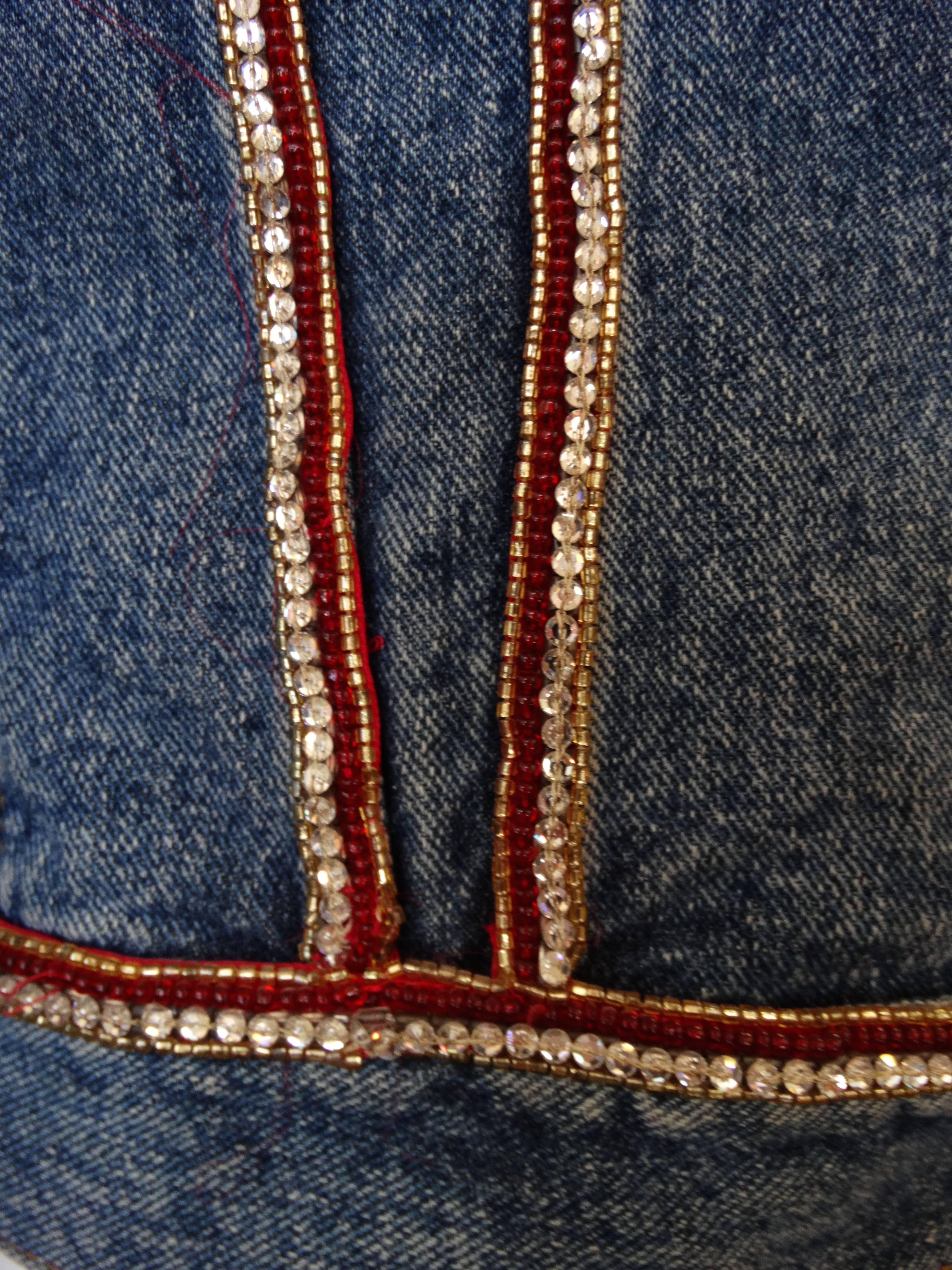 Super rare and never worn- Mary McFadden couture in collaboration with Levi's! Denim Levi's jacket in the perfect blue jean wash. Accented with red beading and crystalline rhinestones down the front and back seams. Cozy oversized classic 80s fit,