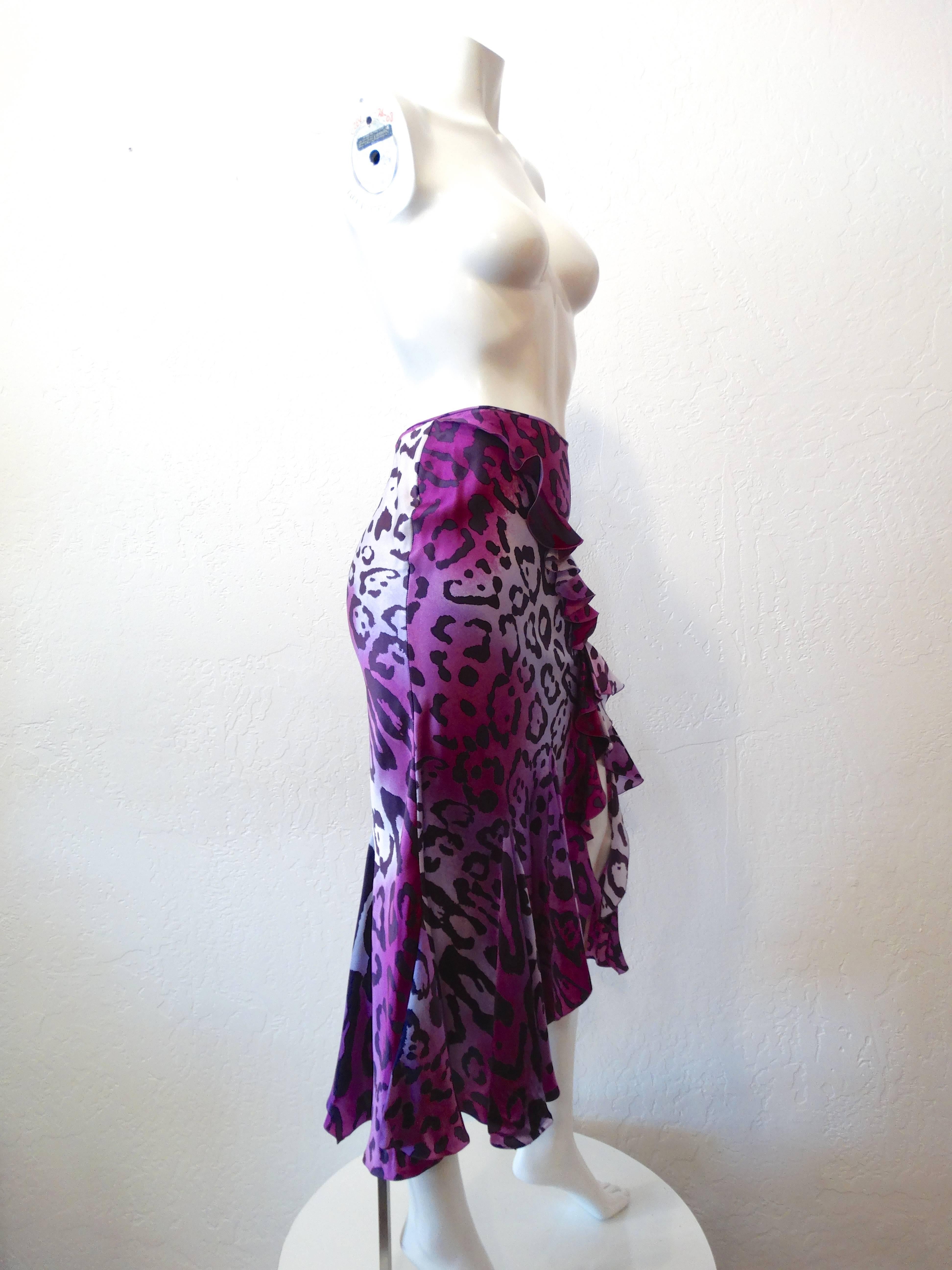 Dance the night away in our incredible 1990s Christian Dior skirt! Vibrant purple leopard printed all over on super soft silk. Super on trend ruffle details with a sexy slit up the left leg. Buttons up the side with matching silk covered buttons.