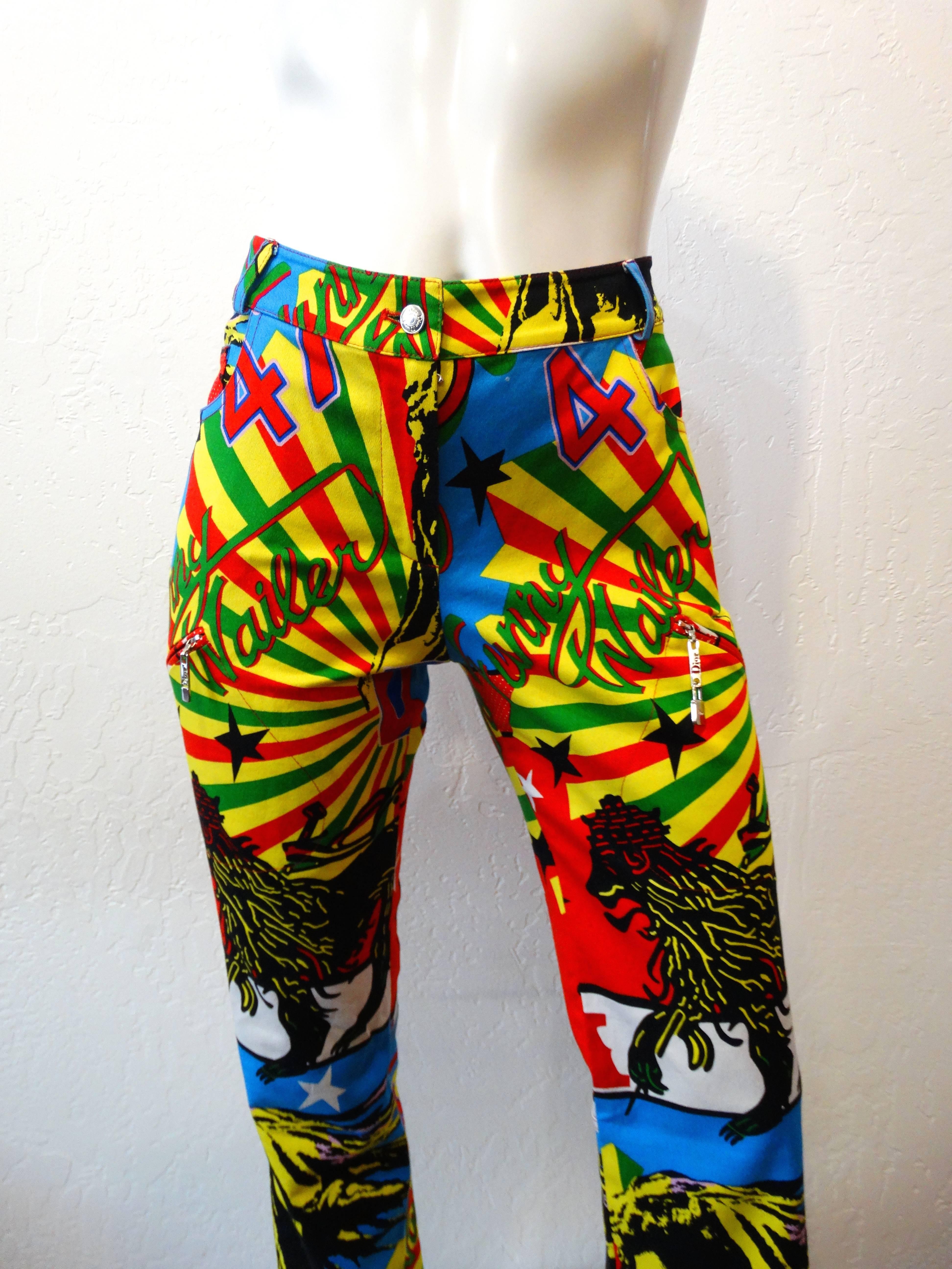 These pants are tie-dye for! Amazing Christian Dior by John Galliano graphic printed pants! Woven cotton pant covered in bright and bold Rastafarian inspired prints, including motifs of Marley and Dior. High rise fit and tapered leg that flare