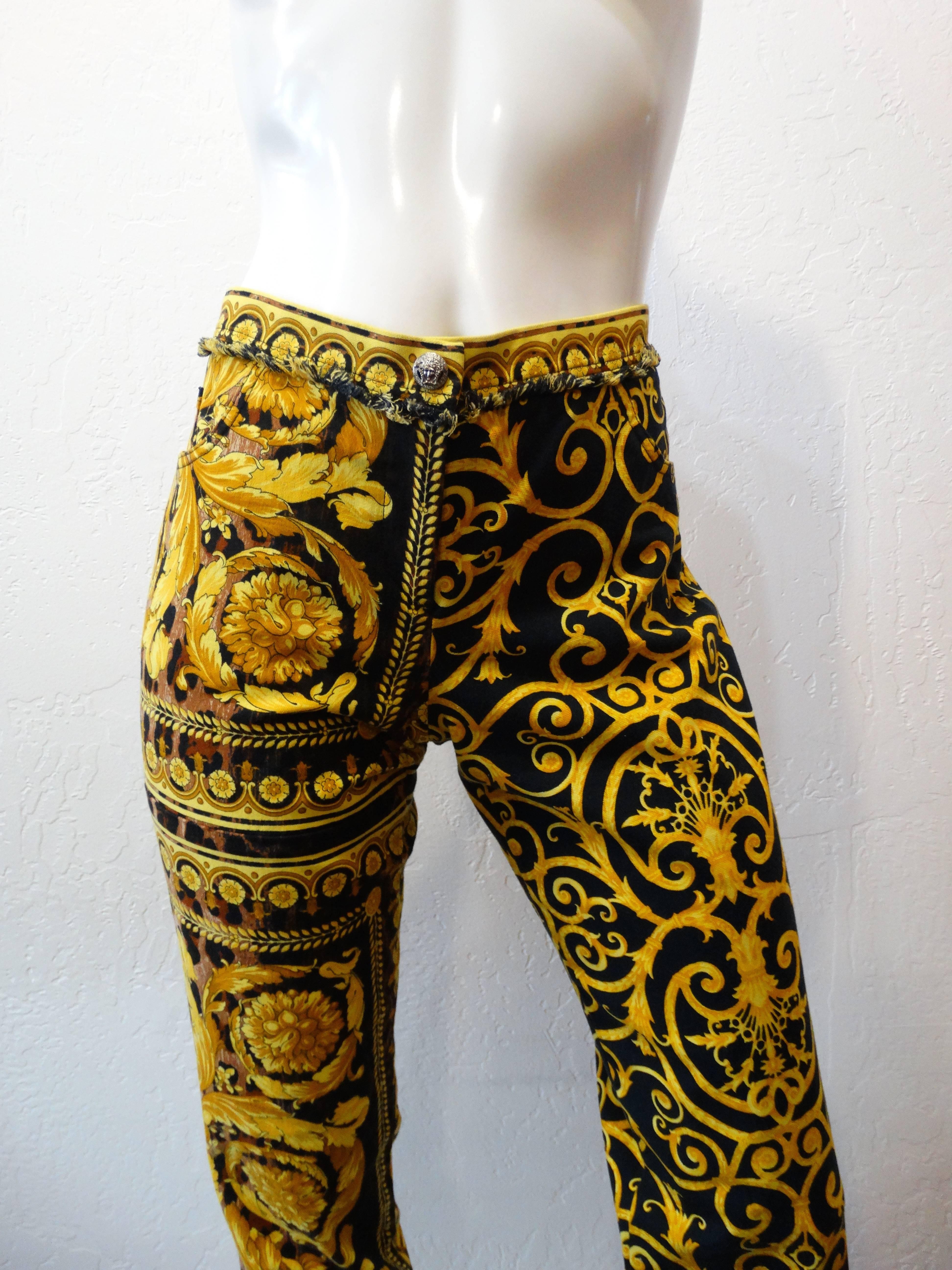 Doesn't get any more Versace than this print! Amazing 1990s Versace Baroque printed pants! Black and gold swirling print with an underlay of leopard print. High rise fit with slightly flared leg. Zips up the front and buttons at the waist. Trimmed