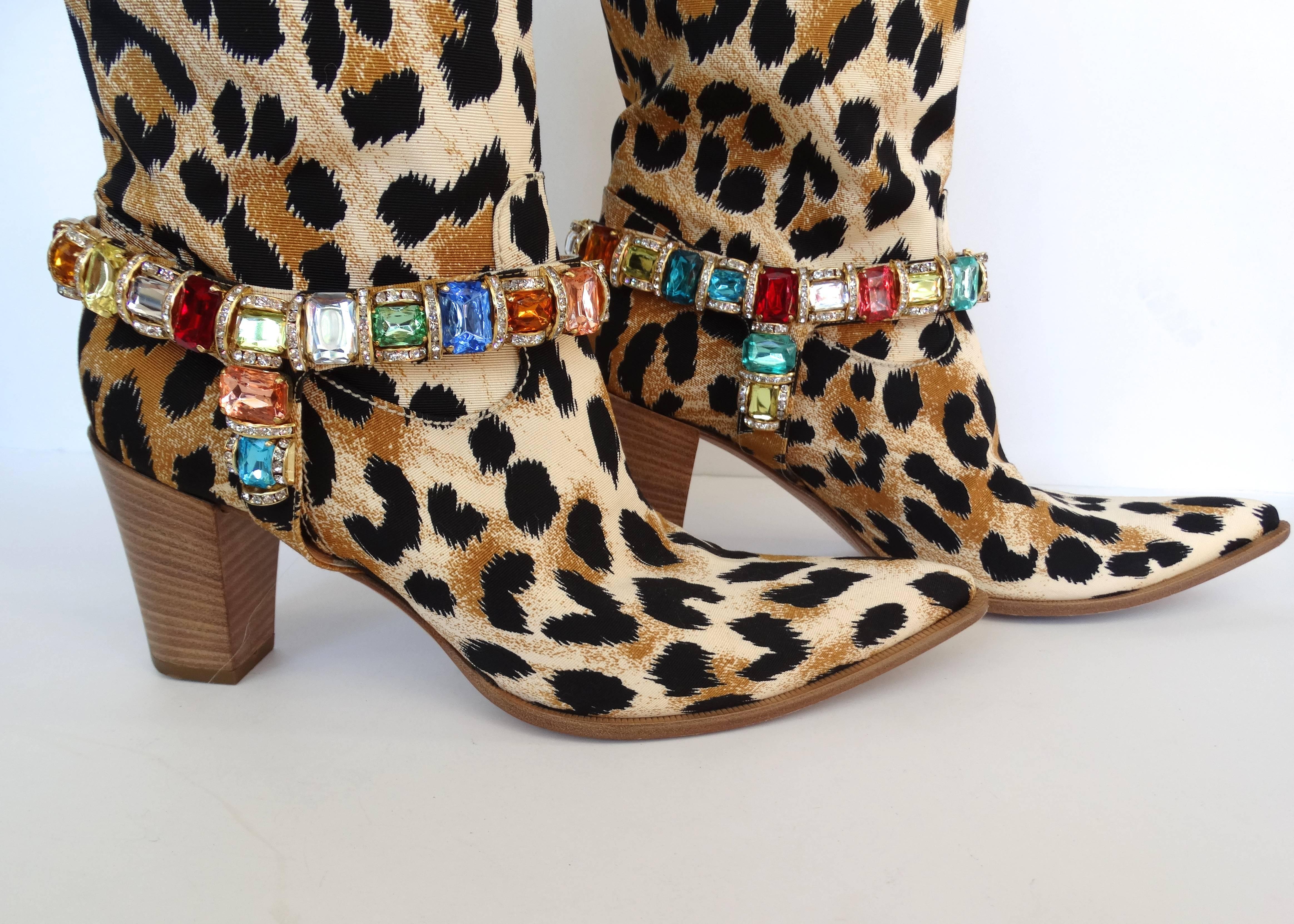 Like a rhinestone cowgirl! Giddy up in our amazing, like-new condition Casadei leopard boots! Leopard printed canvas accented with multicolored rhinestone jewels at the ankles. Pointed style toes with short heels to give you a little height! Pull on