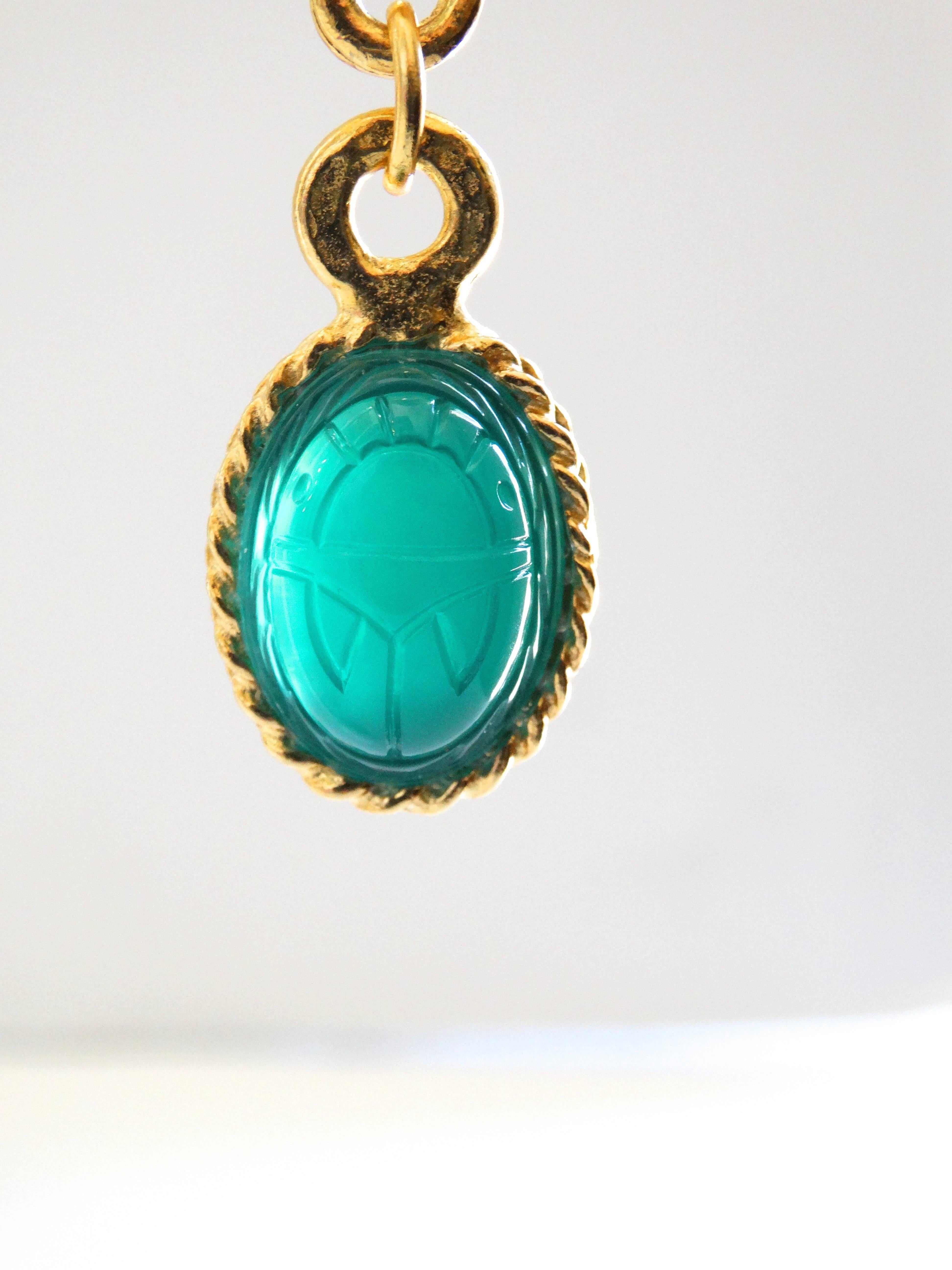 green jewel earrings