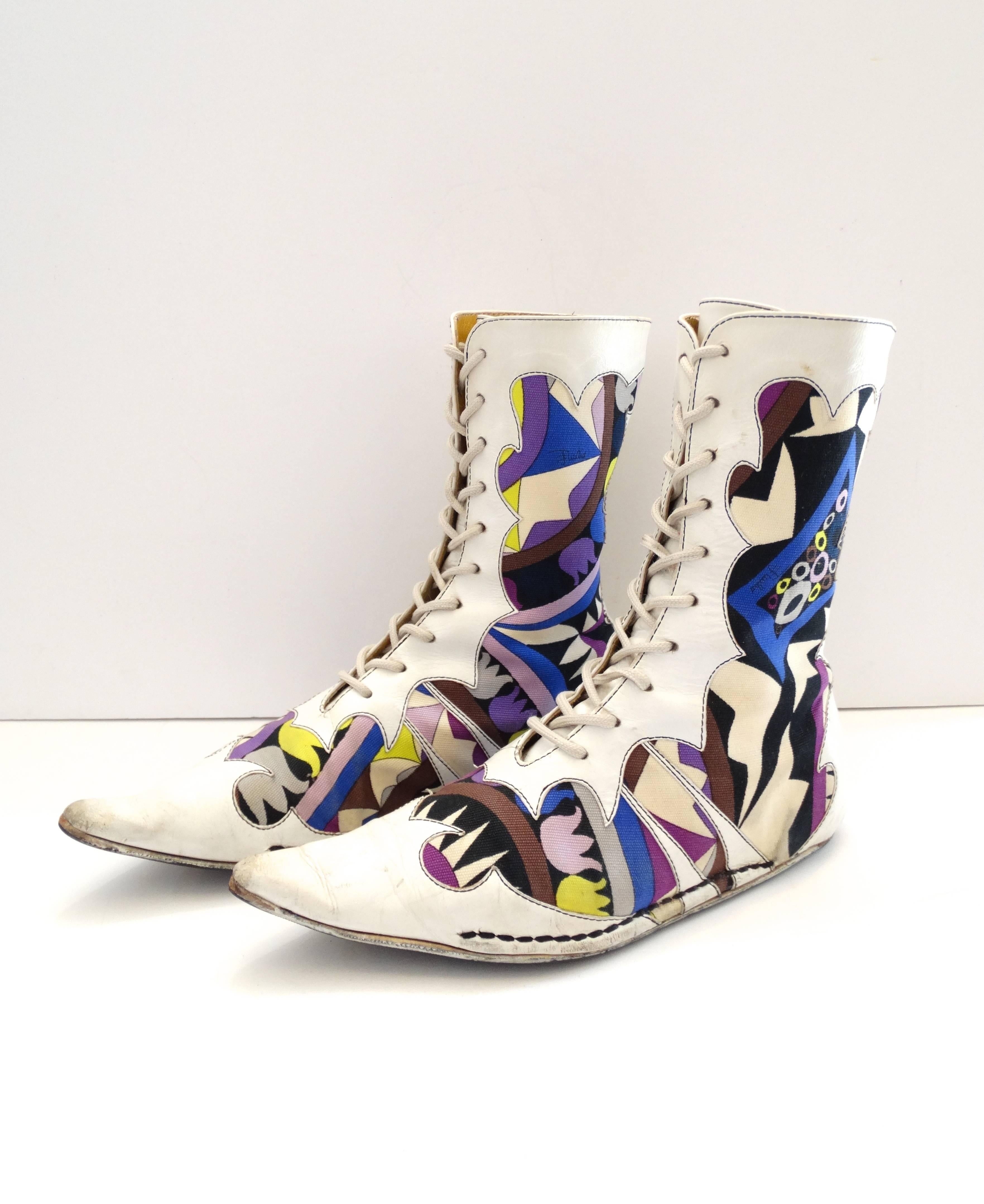 These Pucci boots were made for walking! Incredible rare 1960s lace-up boots from Emilio Pucci! Made of a multicolored printed canvas in signature Pucci geometric swirl motifs. White leather details with Victorian-inspired details, lace up the front