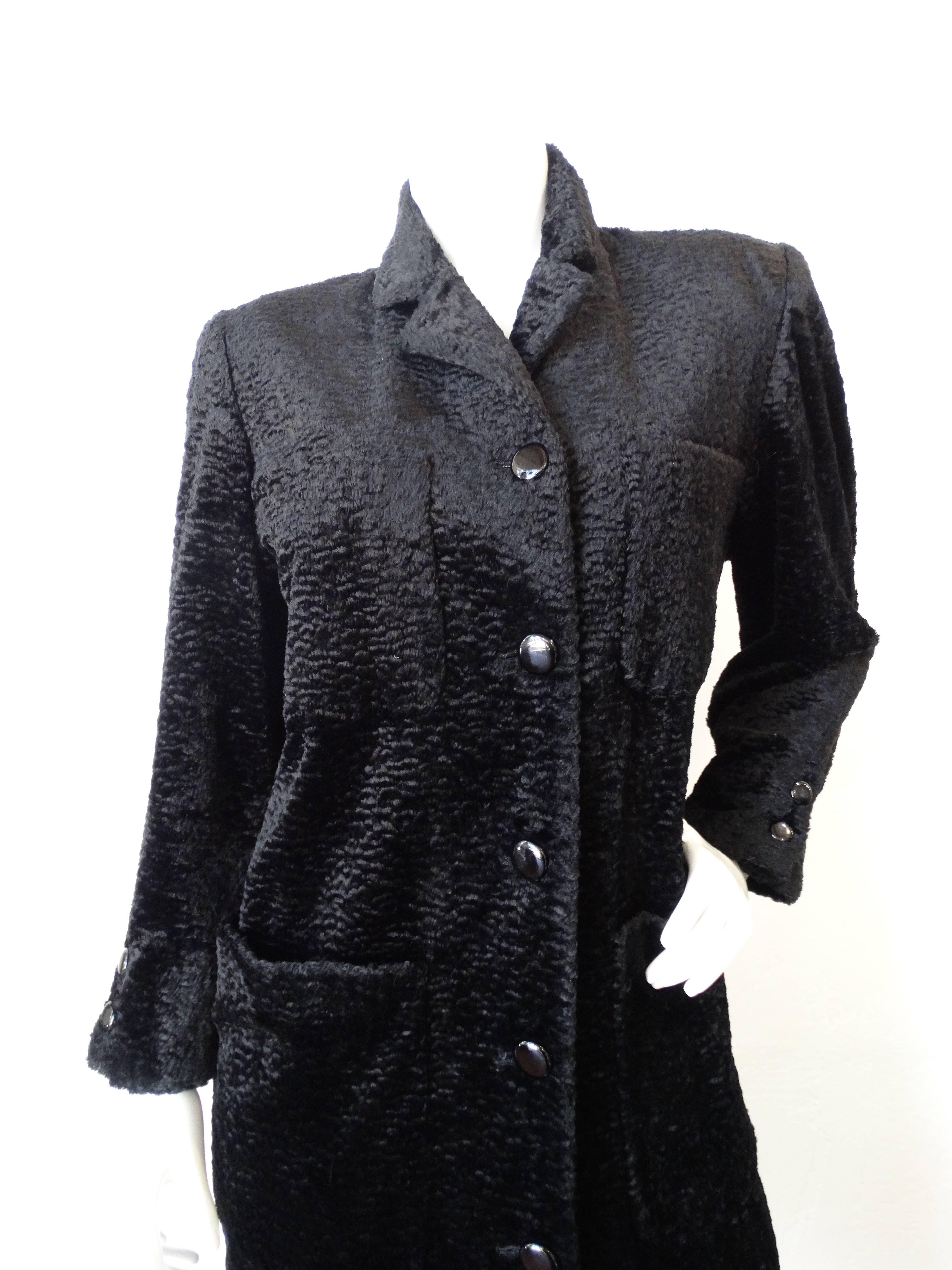 Incredible 1980s faux fur coat from iconic label Fendi 365! Made of a black sheared faux fur with black glossy buttons up the front. Two large pockets on the bust and two pockets at either side of the hip. Fold over collar, buttons on the cuffs.