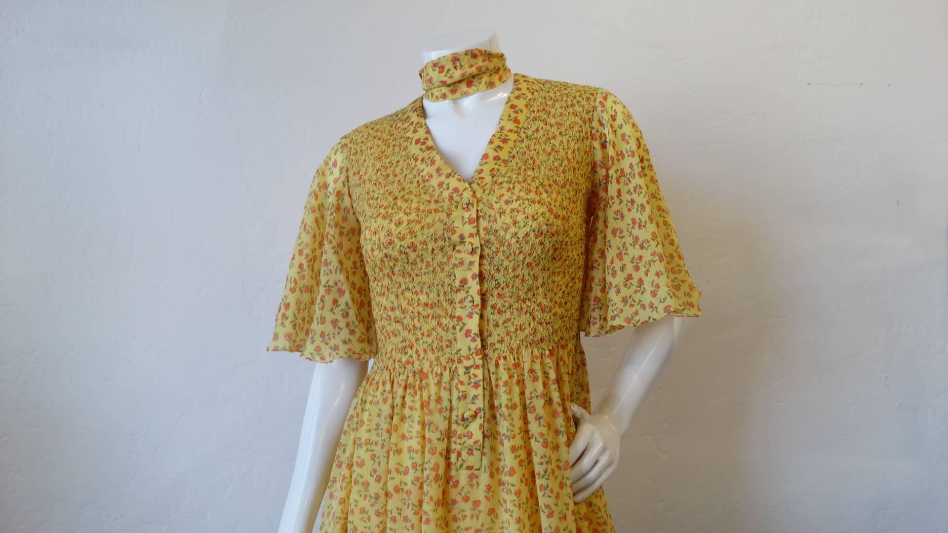 The most charming 1970s silk floral maxi dress from I.Magnin! Creamy yellow floral print with intricate 