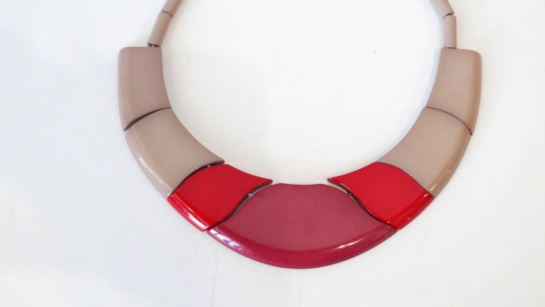  1970s necklace from none other than Guillemette L'Hoir Paris- designer of avant-garde art inspired jewelry made from Galalith. This piece is made out of a taupe and magenta bakelite in a unique, wavy structure. Beaded along the back of the neck,