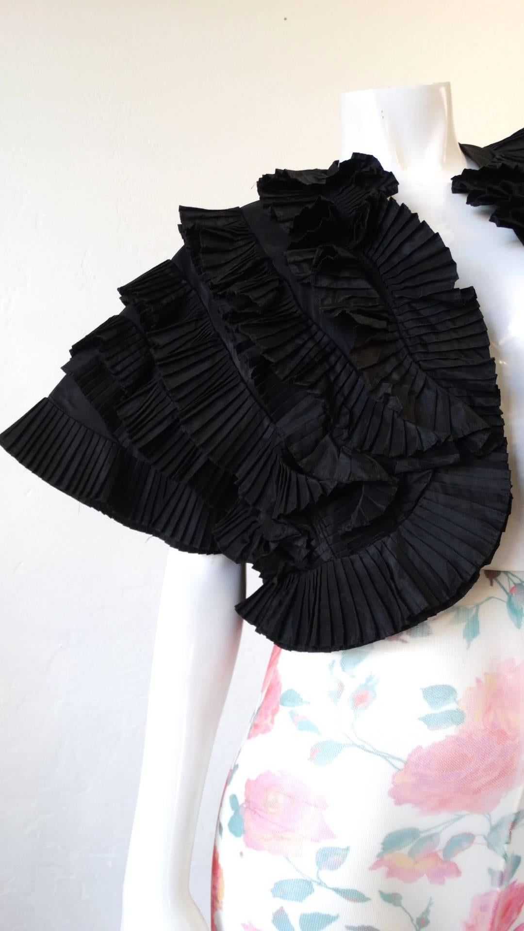 1980s fan pleat bolero jacket from vintage label Richilene New York! Unique pleated construction arranged in a fan-like structure. Short sleeves that wing out at the shoulders. Bolero style fit, wears open. 

This Jacket measures 17