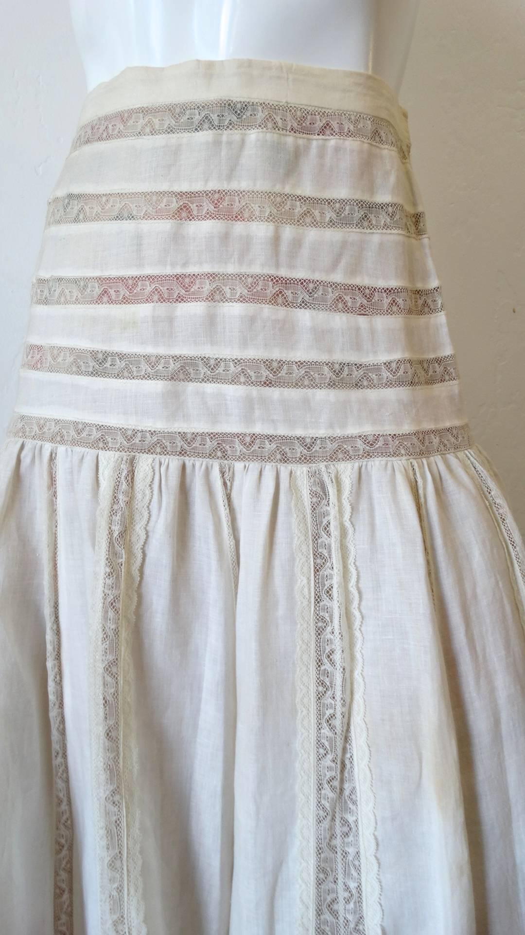 Your perfect summer skirt has arrived with our amazing 1980s white lace maxi skirt from designer Yoly Munoz. Made of a white cotton and sheer lace fabric, striped around the waist and hips. High rise fit and maxi style length.  This skirt is marked