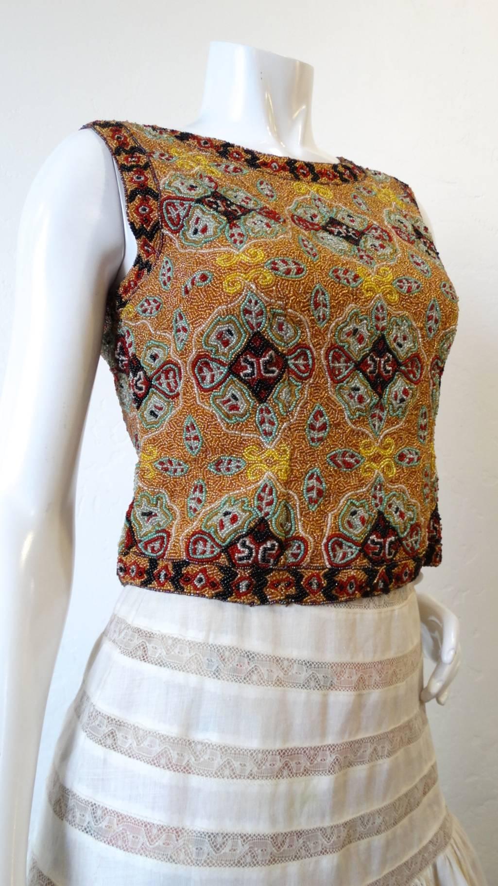 Beading and embellishment is so en vogue- rock a unique piece of your own with this amazing beaded sleeveless shell top from Indian label Christiana! Sleeveless shell construction covered in intricate seed beads. Wear with your favorite vintage