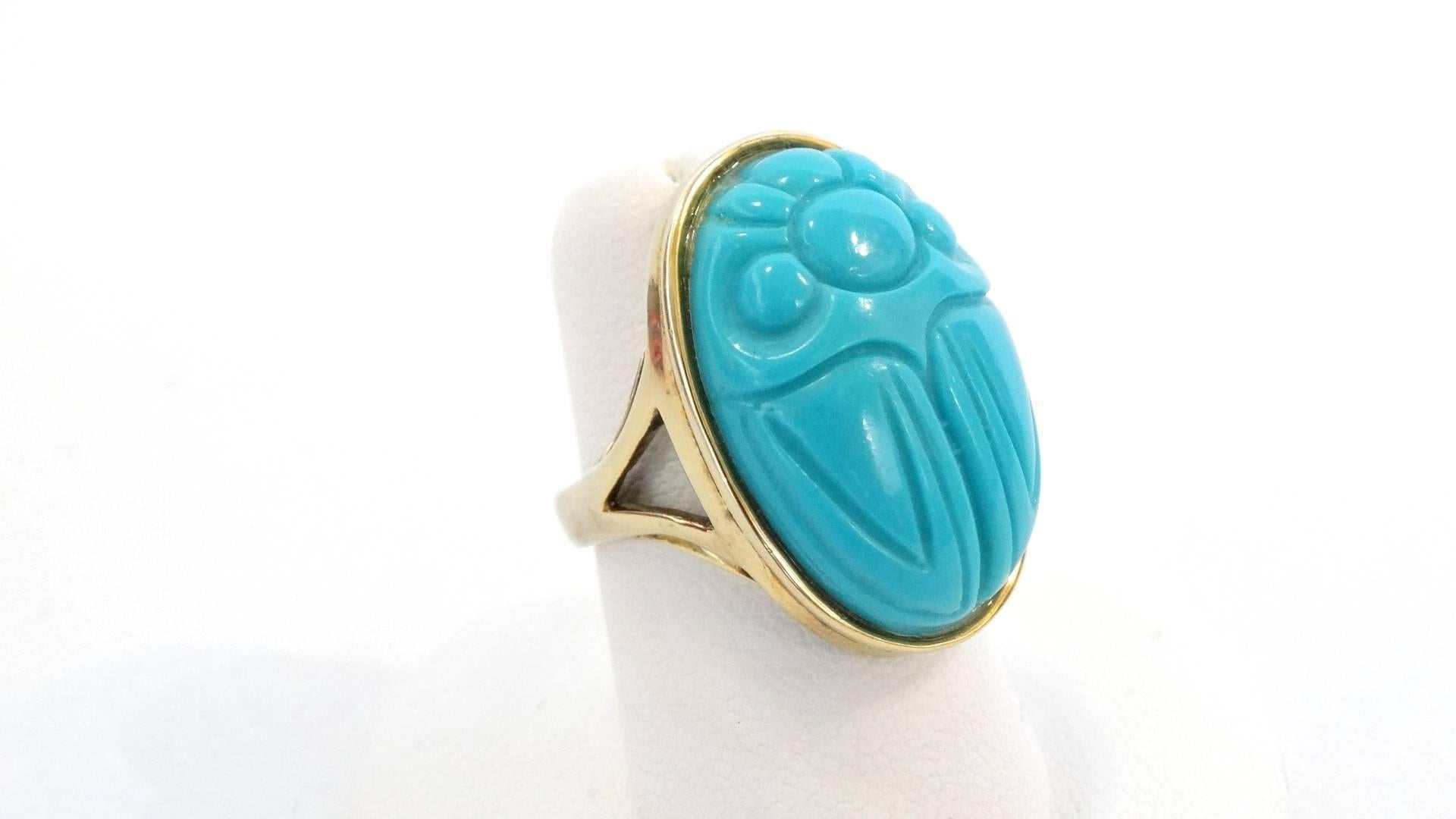  20th century vintage gold and turquoise beetle ring! Made of solid sterling silver and plated in gold. Glass turquoise carved scarab beetle charm at the center. Pairs perfectly with a handful of dainty gold rings. 

Gold plated on sterling silver