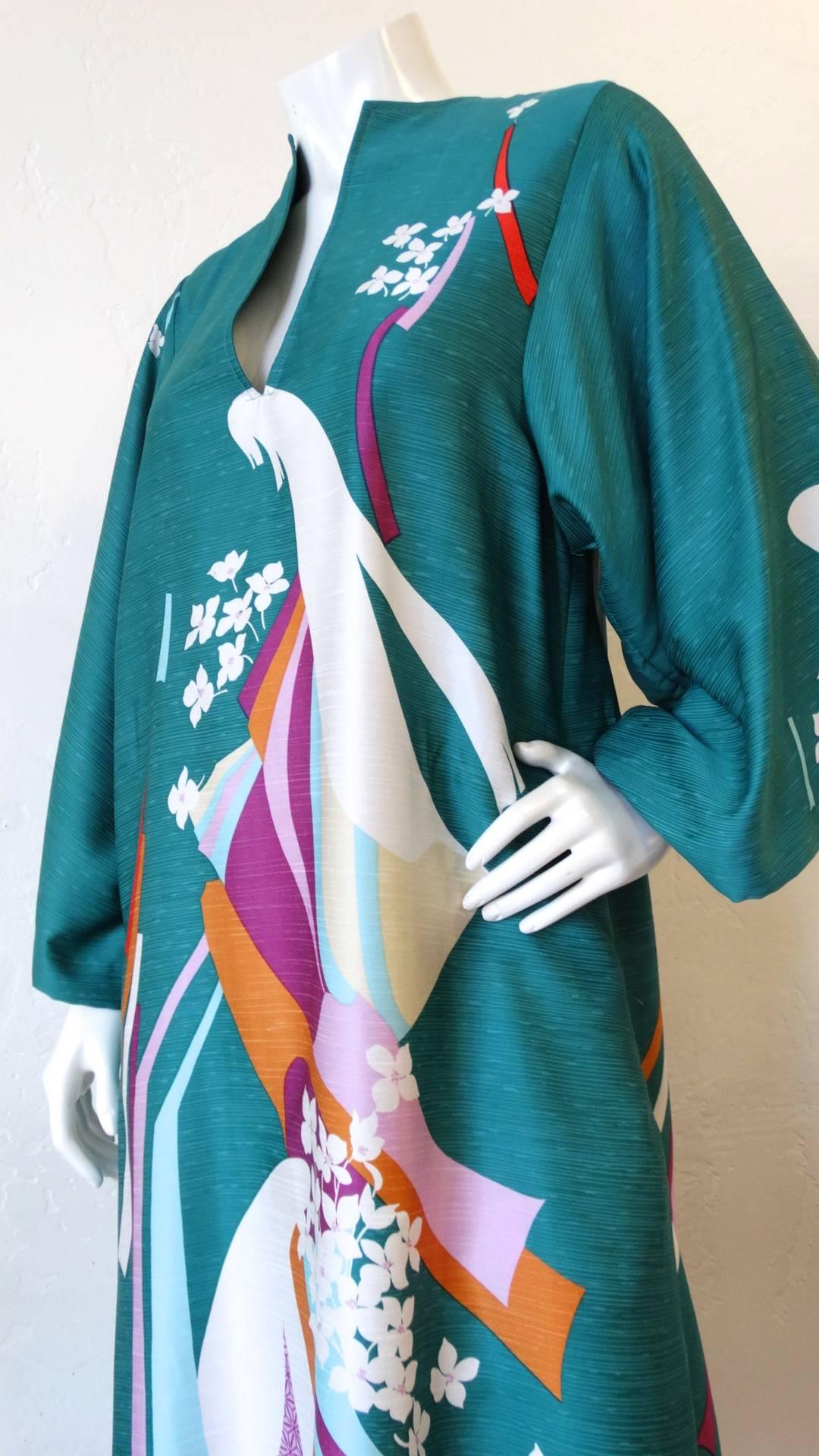 We love a good Kaftan-and you will too with this amazing 1970s Asian motif dress from Neiman Marcus! Breezy, oversized fit- printed with the dreamiest asian inspired swirls and flowers. Long, kimono-like sleeves with a slit neckline. Pair with your