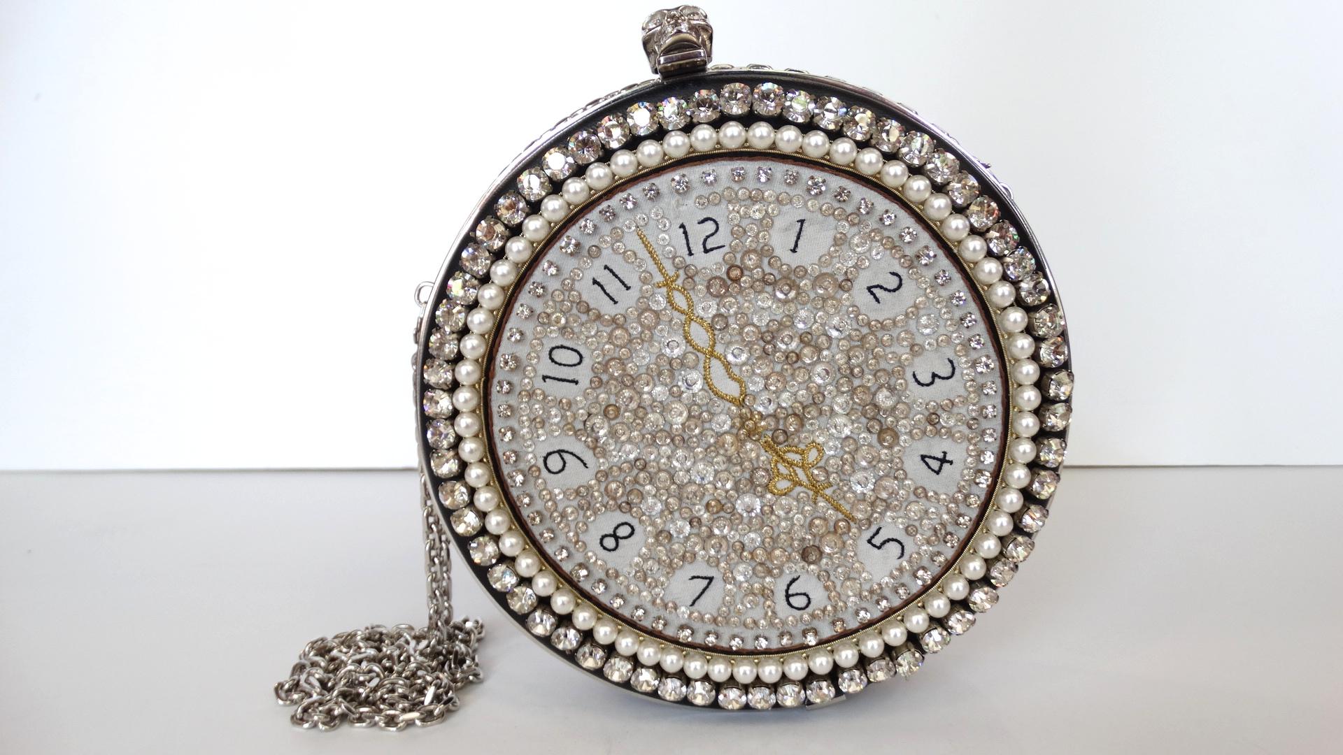 Its high time you treated yourself to a little McQueen- score yourself the perfect piece with our Alexander McQueen embellished rhinestone clock clutch! Made of 100% black lambskin leather and absolutely bedazzled in rhinestones and faux pearls.