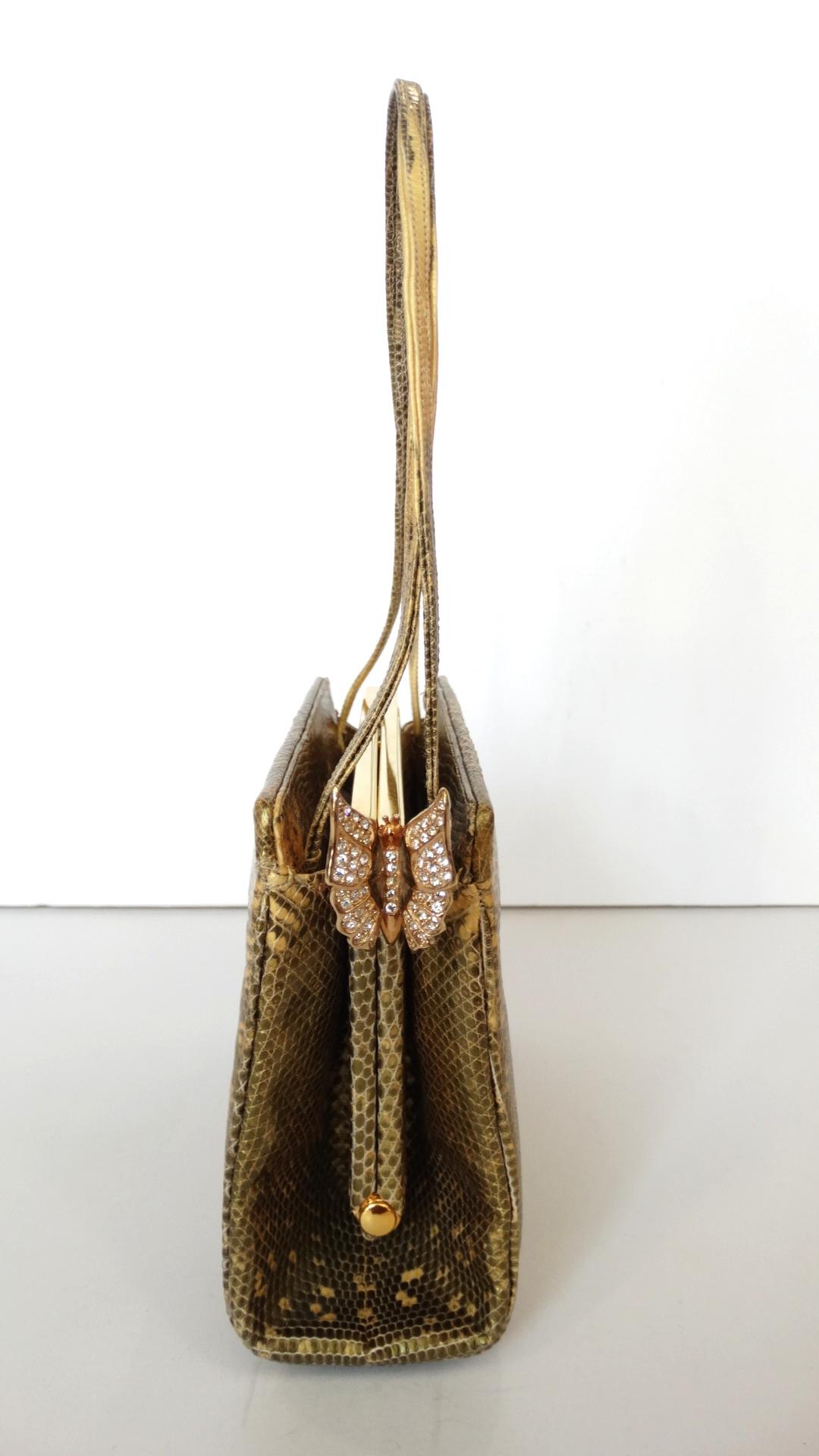 The most adorable little Judith Leiber snakeskin handbag bag! Constructed of a unique spotted gold snakeskin in a structured rectangular silhouette. Thin shoulder straps crafted from the same skin. Rhinestone enameled butterfly clasp on the side of