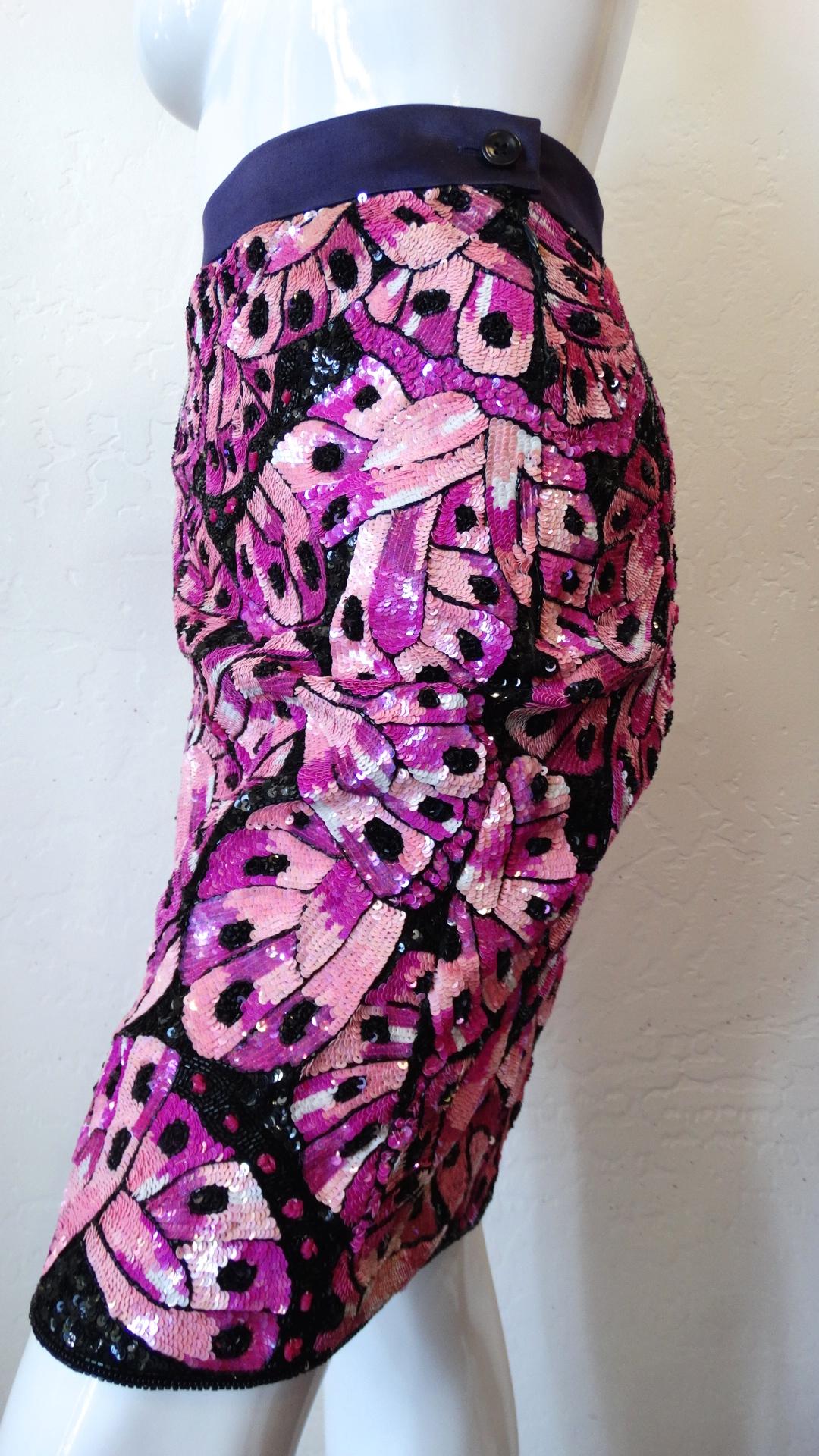 Add some sparkle to your summer wardrobe with our oh-so-sequined 1980s Escada Couture pencil skirt! Purple satin skirt absolutely covered in pink, magenta and black sequins in a butterfly wing pattern! Flattering fitted silhouette with pencil style
