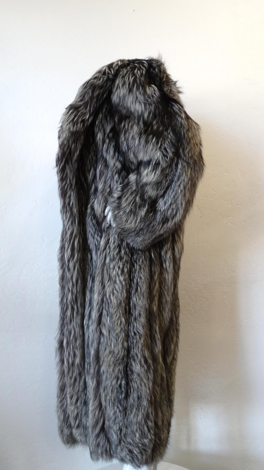 The most luxurious silver fox fur coat from designer James Galanos, circa 1980s! Super plush silver and black fox fur sewn in vertical lines up the front and back. Long length, oversized silhouette. Big, dramatic fur collar, perfect for draping off