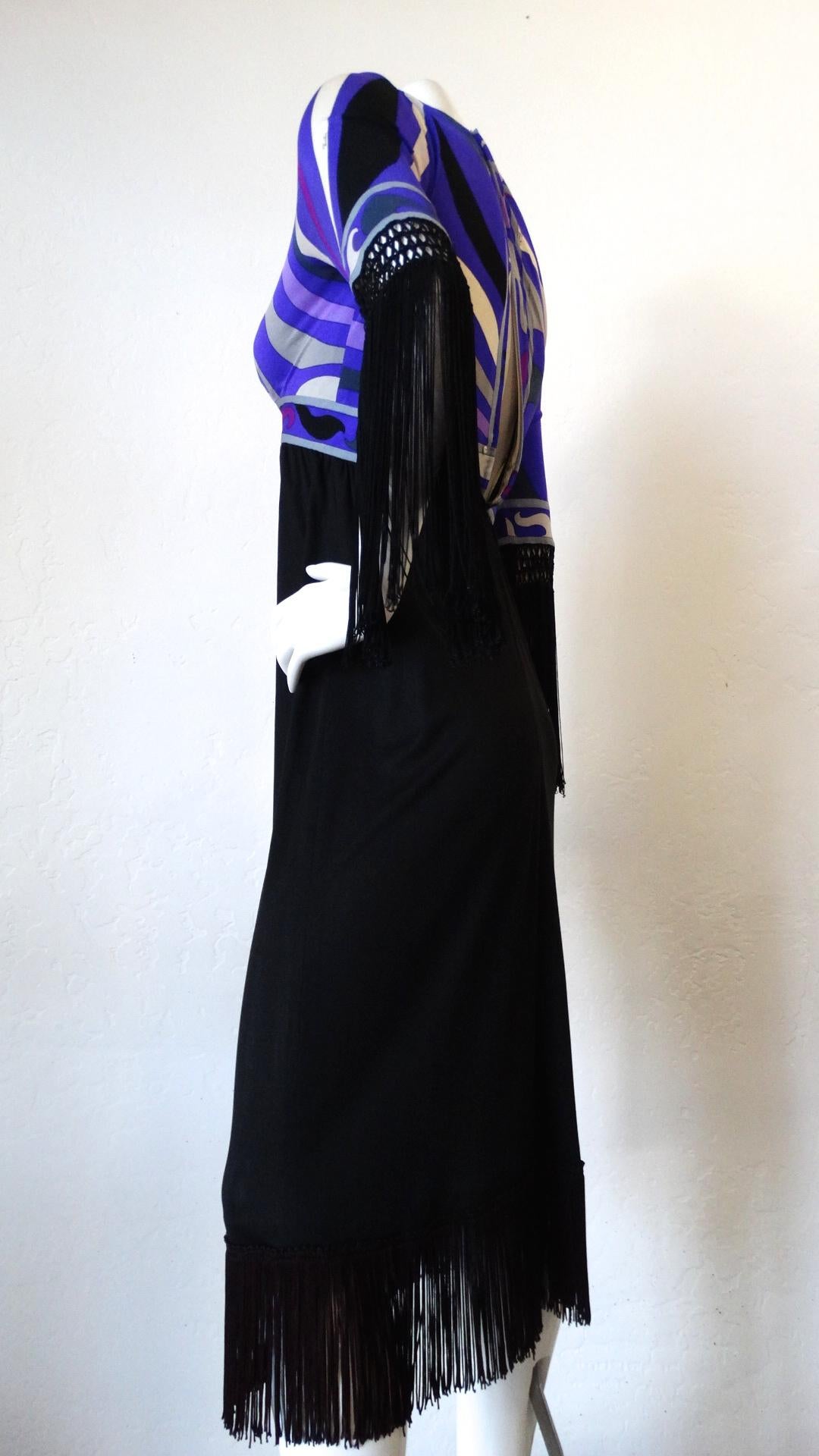 No Pucci collection is complete without our amazing 1960s Emilio Pucci printed fringe dress! Bust features Pucci's signature swirling pattern in incredible shades of purple! Woven, long black fringe trims each of the sleeves, adding just the right
