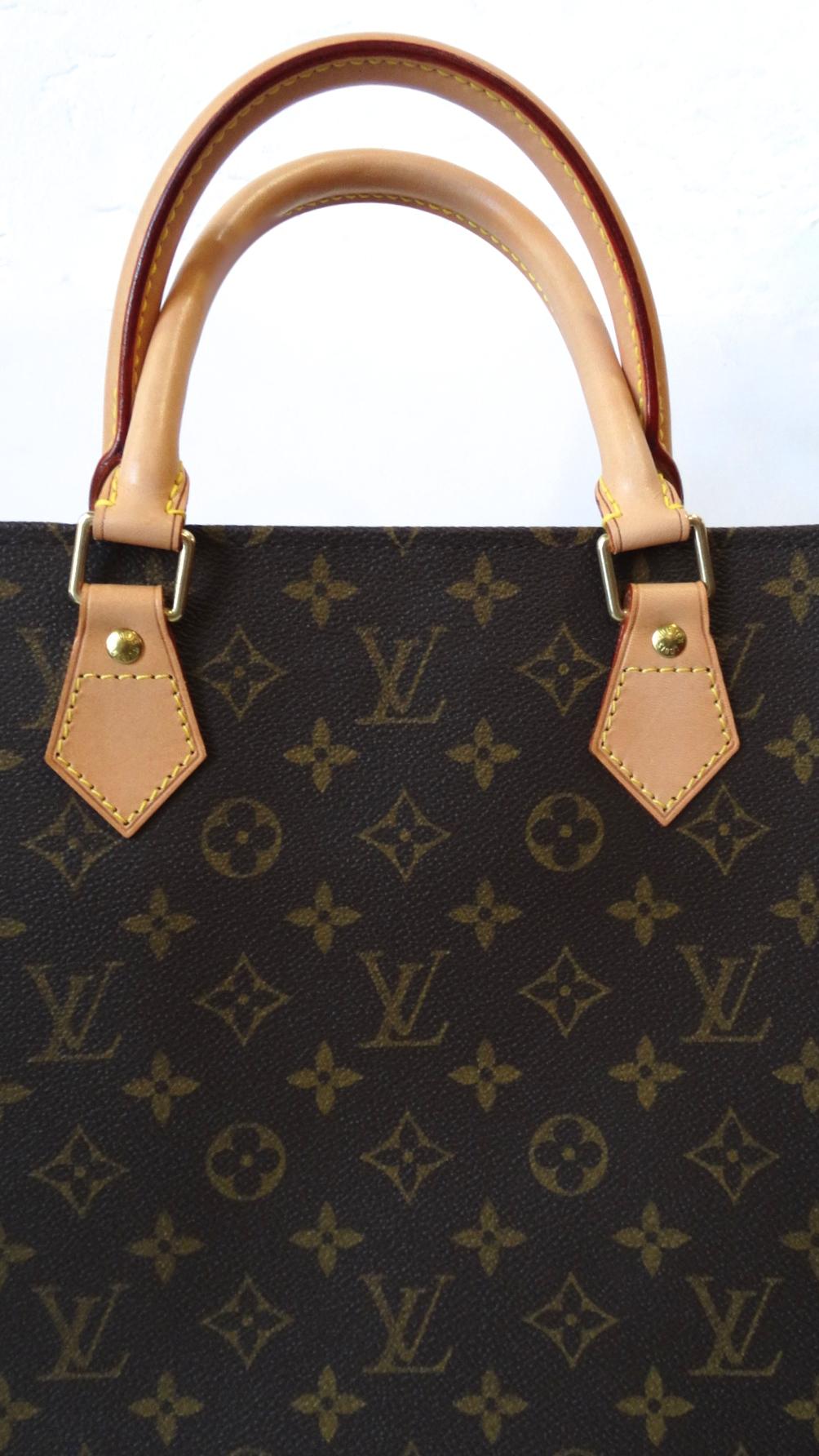 Amazing 2000s Louis Vuitton Sac Plat in none other than the brown Monogram print! This style is no longer available at Louis Vuitton, making this a rare and fun classic to add to your collection! In fantastic condition, with no signs of patina on