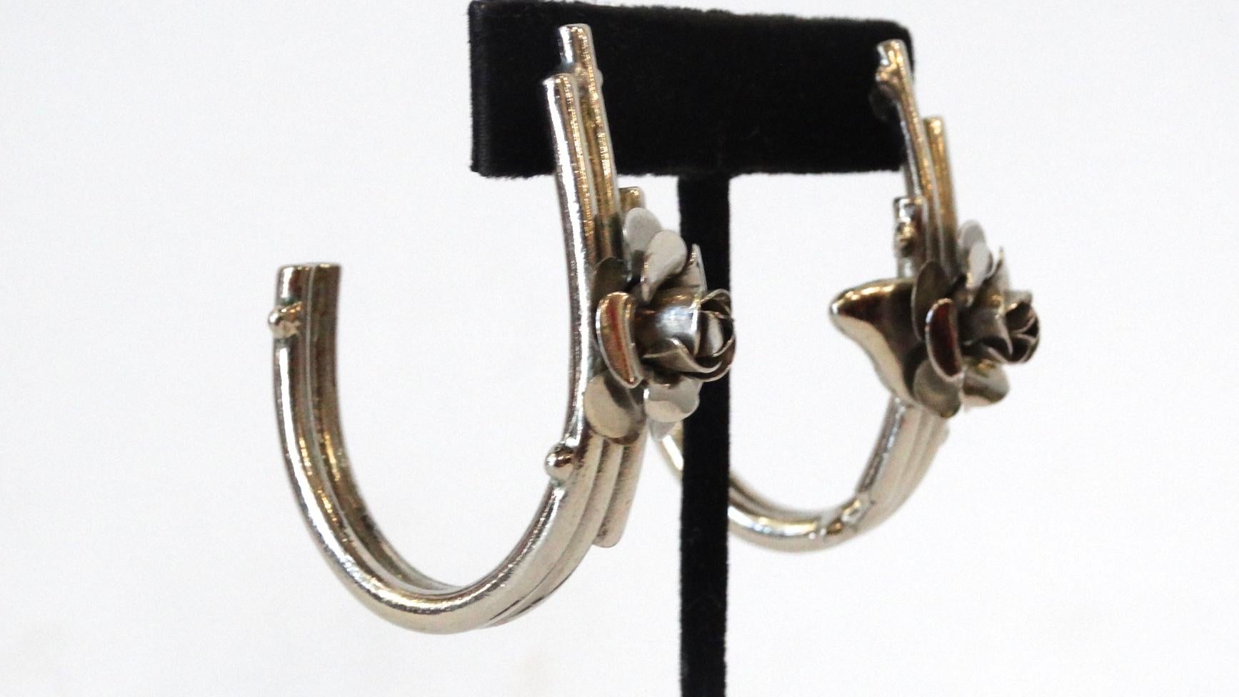 The most adorable pair of silver hoops from prolific designer Gianni Versace! Vintage silver Versace is hard to come by- these pieces are exceptionally special as they come inspired by the S/S 1986 Versace collection. Layered, silver hoops adorned