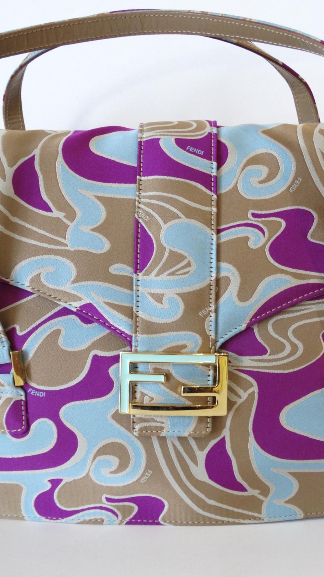 The Fendi flap bag is back! Rock a unique piece of your own with our incredible Fendi psychedelic swirl bag circa 2000s! Structured rectangular shape, covered in a soft canvas material. Printed all over in unique swirling pattern, in shades of