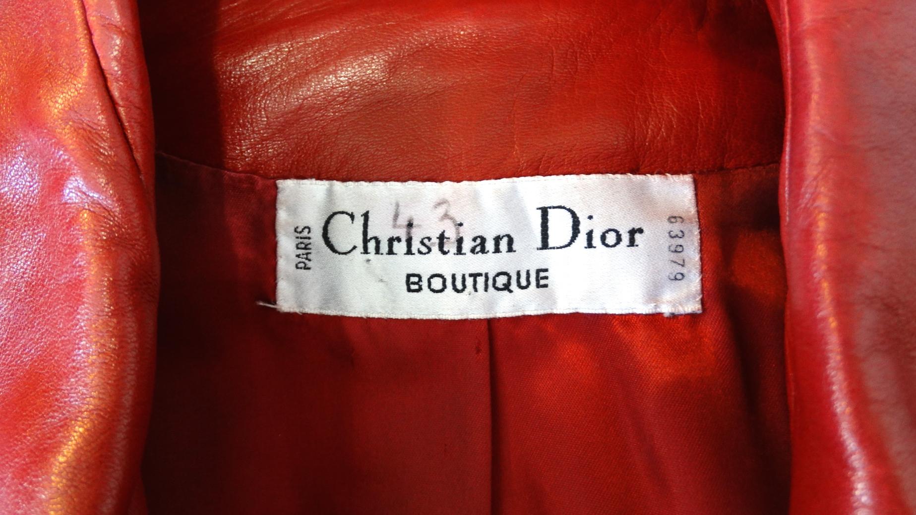 Your perfect piece for fall has arrived- with our luxurious red leather jacket from circa 1980s Christian Dior! Made of a soft, rich red leather and accented with contrasting, detailed leather trim on the pockets. Leather wrapped buttons up the