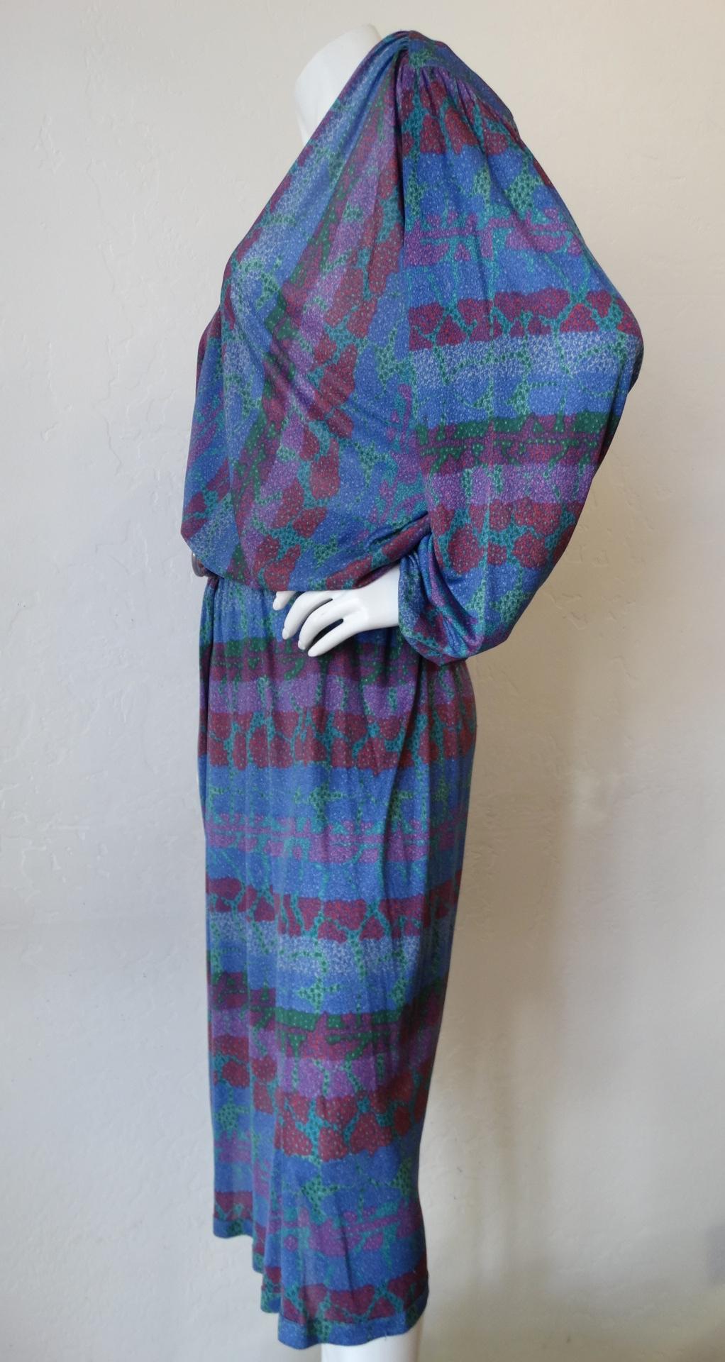 Searching For Some Missoni In Your Life? Look no further! This 1970's silk Missoni dress is exactly what you need! An allover abstract motif of blue, green, red and purple give off all those 70's vibes. The silk fabric falls effortlessly and