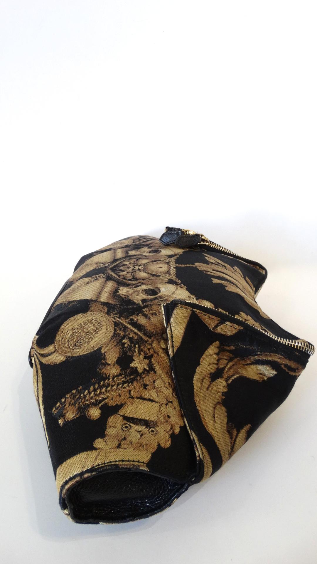 The Most Amazing Clutch Has Arrived And It Won't Disappoint! From Alexander McQueen's final 2010 collection, this clutch is 100% Silk and features a black and gold Gibbons motif with quilted corners. A gold double zipper top closure with magnetic