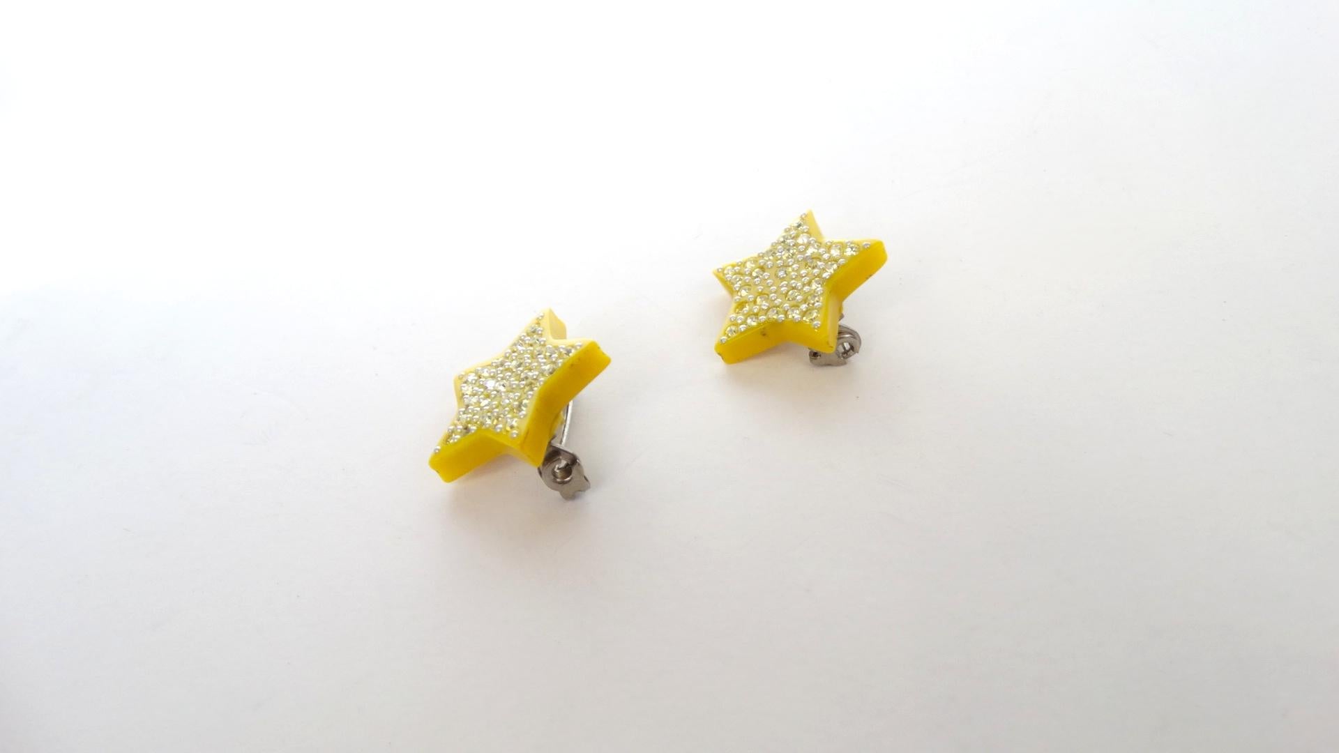 Brooches Are The New Hot Accessory This Season And We've Got You Covered! Circa 1970's, these Lea Stein mini star pins are sure to keep you starstruck with their bright yellow color and jewel encrusted finish. Perfect to wear together or separate,