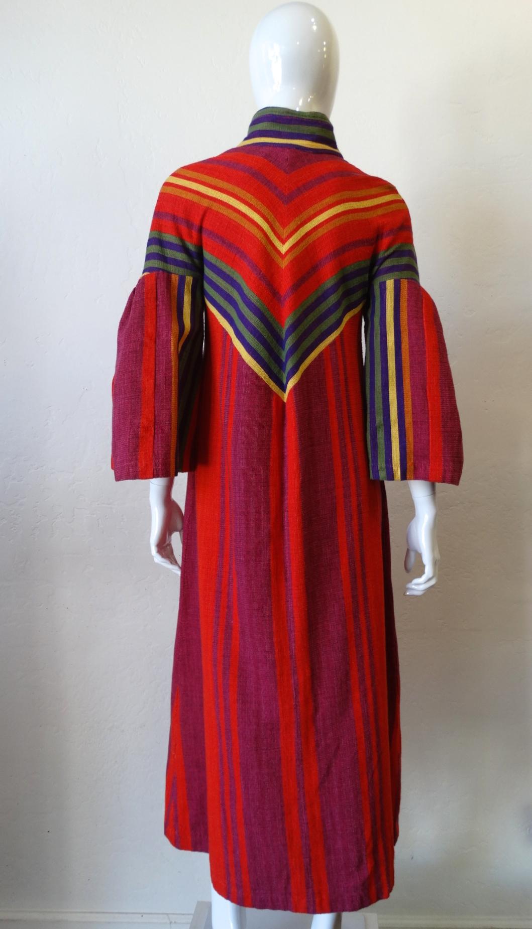 The Perfect Rikma Is Waiting For You! Circa 1970s, this Rikma features a colorful rainbow asymmetrical striped motif and a zipper front with a slit. Flounce sleeves and a classic shirt style collar which can be stood up for a mandarin style collar.