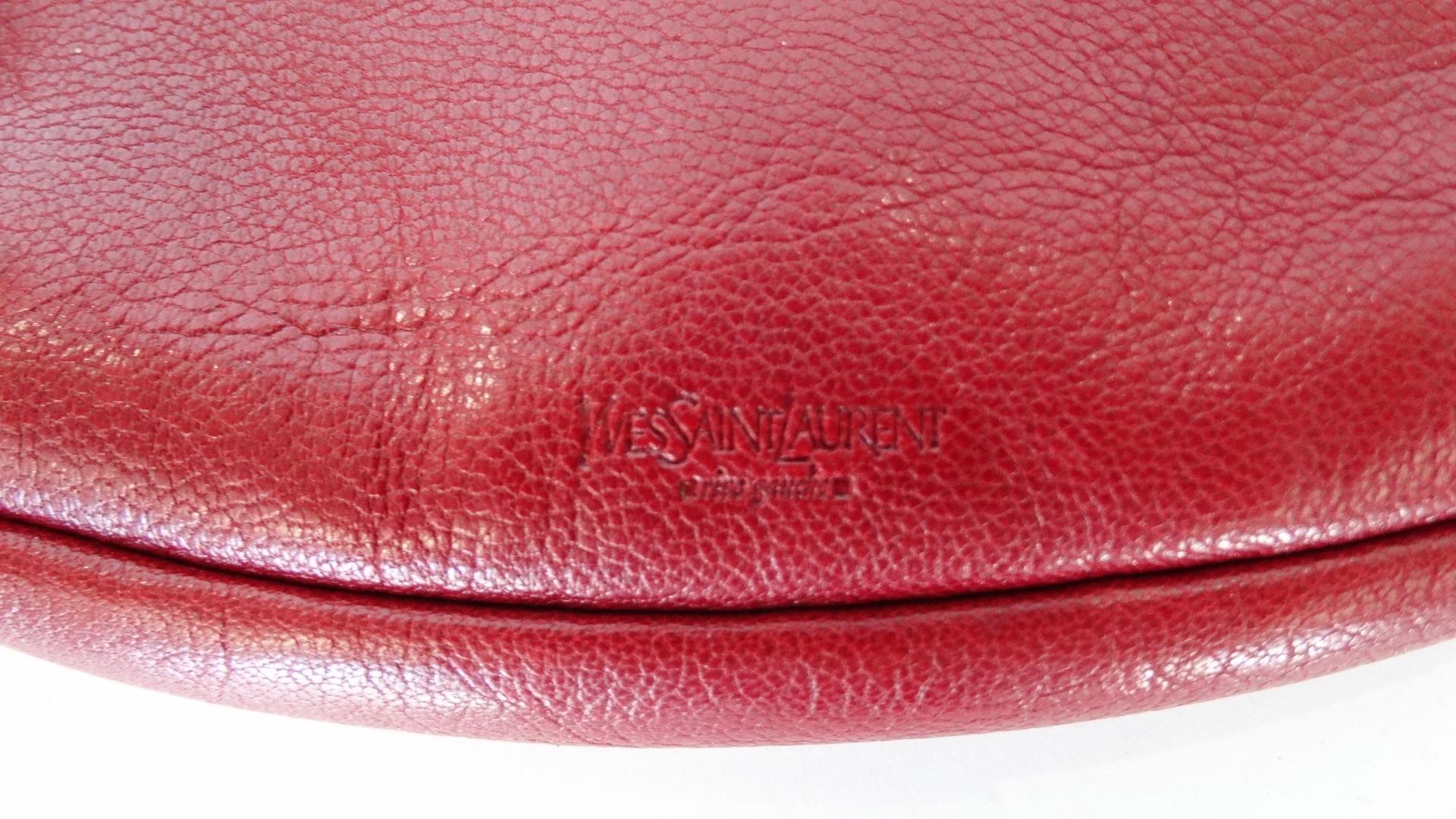 Show Your Love For YSL With This Adorable Pouch! This lips pouch is made of red pebble grain leather with a red top zipper. Interior is fully lined and tagged YSL. Use this as a wallet, to store your lipstick or for travel! Made in Italy with serial