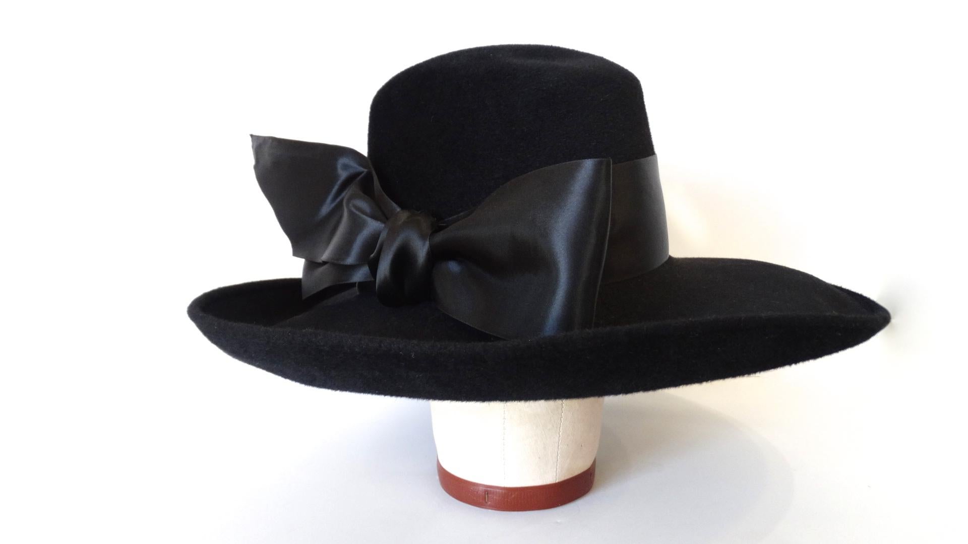 The Most Chic and Classic Hat Is Here! Circa 1960s, this wide brim bowler hat is made of genuine velour and features a large decorative bow around the crown. Perfect with any outfit! Made in Poland.

Note: This timeless hat brand was created by two