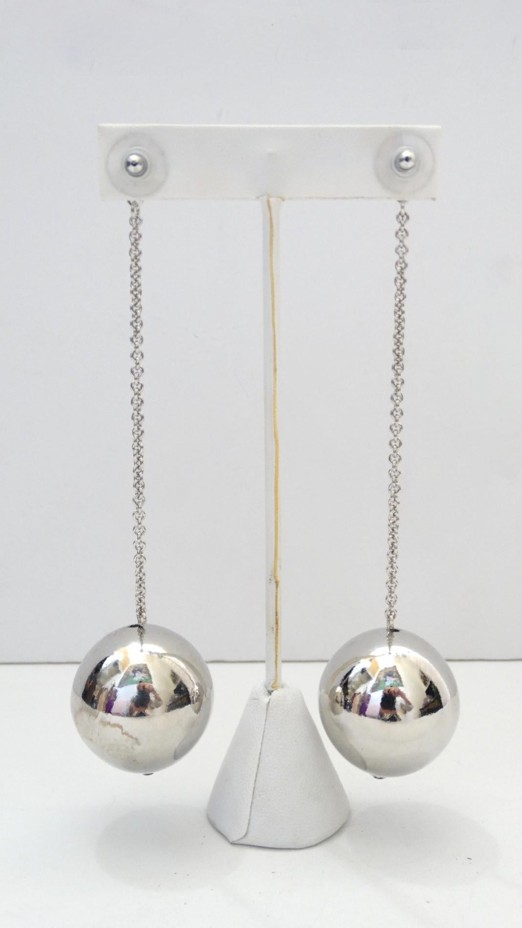 How fun are these lovelies?!  Silver plated, these earrings feature a chain link which is accented with a single ball at the bottom. Earrings are pierced, Designer unknown Drop down 4 inches 