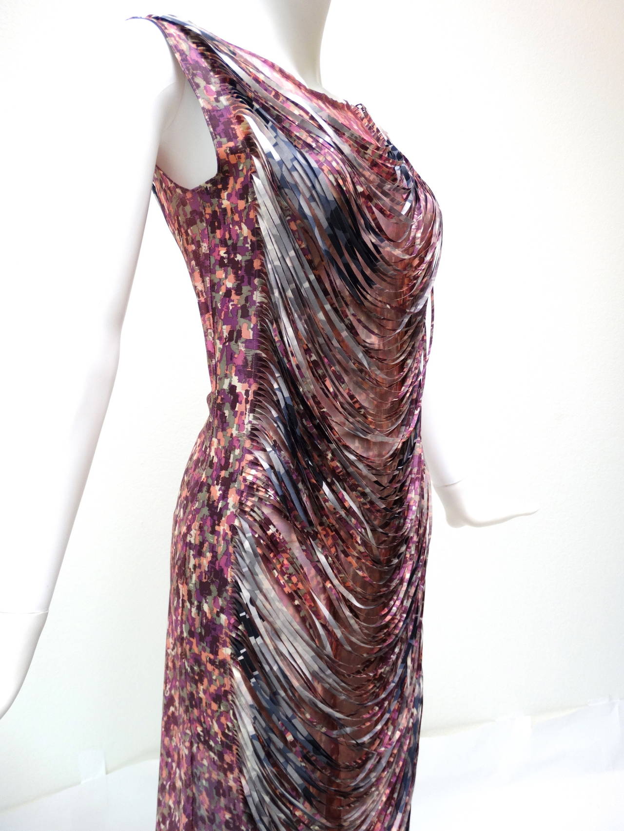 This fabulous dress is Yoshiki Hishinuma - Ready-to-Wear - Runway Collection from 2002 it has a great mosiac print in pinks, grays and white and is completely sheer in the front covered by draping shredded facbric in the same print and reinforced on
