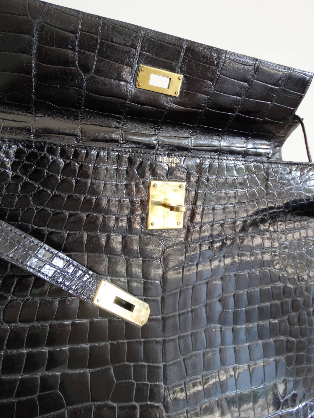 Hermes Kelly Porosus Crocodile, handcrafted by the artisans of Hermes into an iconic 35 cm Kelly from 1984. Hermes black 