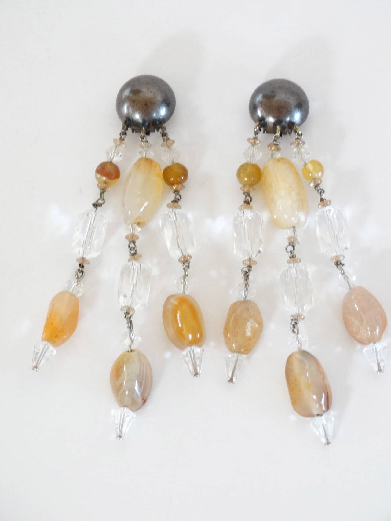 Beautiful 1980's Giorgio Armani Runway Clip Earrings with Natural Polished Stones and Crystal Glass Beads. Stones are neutral in color, Silver clips signed Giorgio Armani on the inside back. 

Measurements: 4