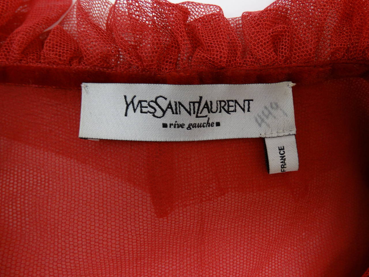 Very rare ruffled red silk net blouse and skirt designed by Tom Ford for Yves Saint Laurent, fall 2002. Ensemble fits a size 2-4. Blouse measures: 32-34
