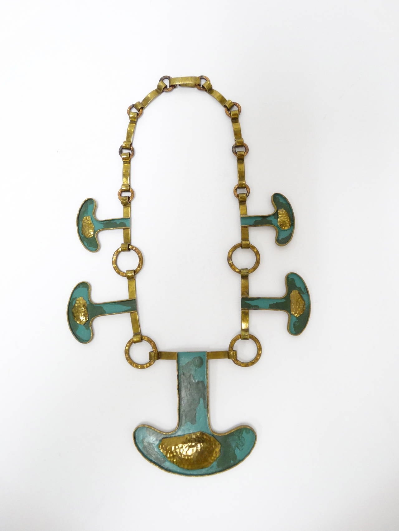 Casa Maya Mexican Hammered Brass Modernist Necklace circa 1960's. This is a beautiful necklace created by Casa Maya made of copper and brass polychrome in greens with large hammered brass in the center of pendent signed 