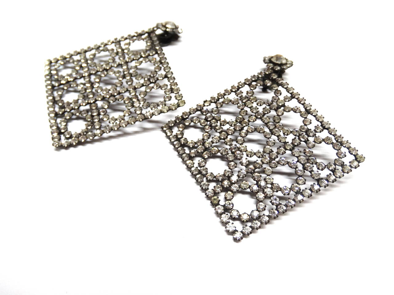 A rare pair of Kenneth Jay Lane crystal earrings! In a gun-metal “cuboct lattice
