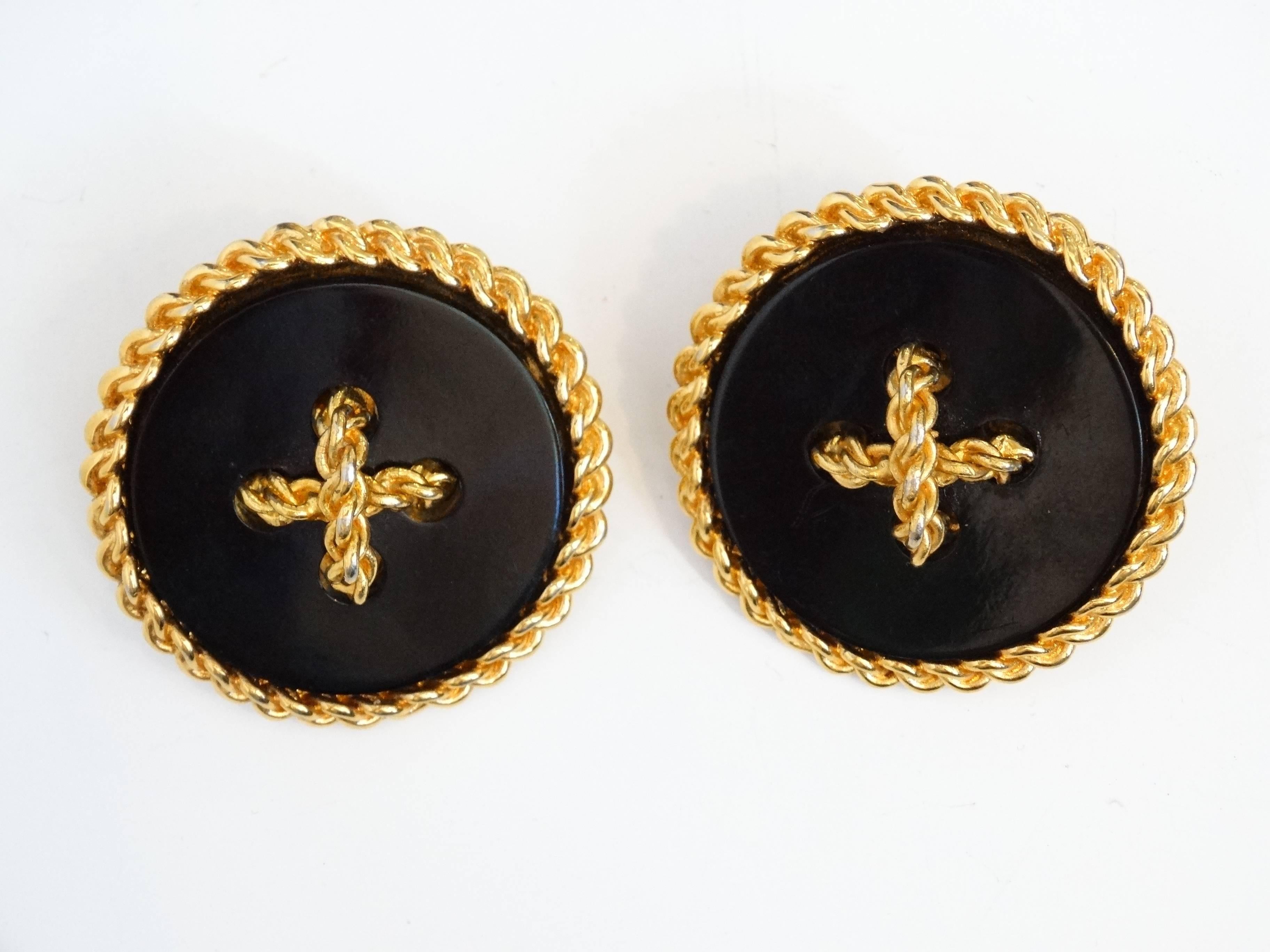 Large beautiful vintage Coco Chanel 80's black button and gold plated earrings. The Chanel signature inside the oval cartouche is the mark used by the House of Chanel on couture jewelry pieces. The numbers signify the collection design is by